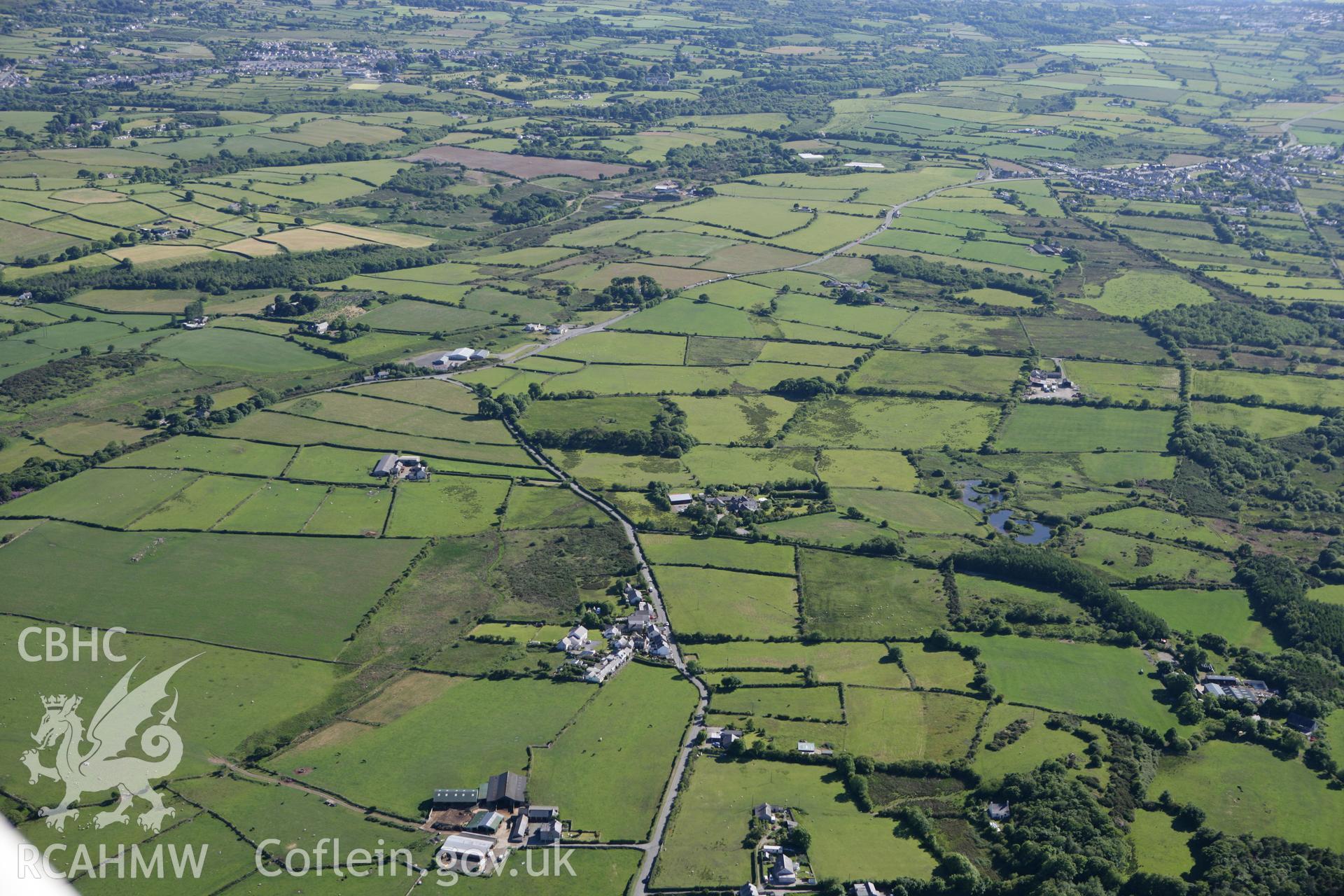 RCAHMW colour oblique photograph of Fachell Roman Road Segment (part of RR67C Caerhun-Caernarfon route), with Bethel village in the distance. Taken by Toby Driver on 16/06/2010.