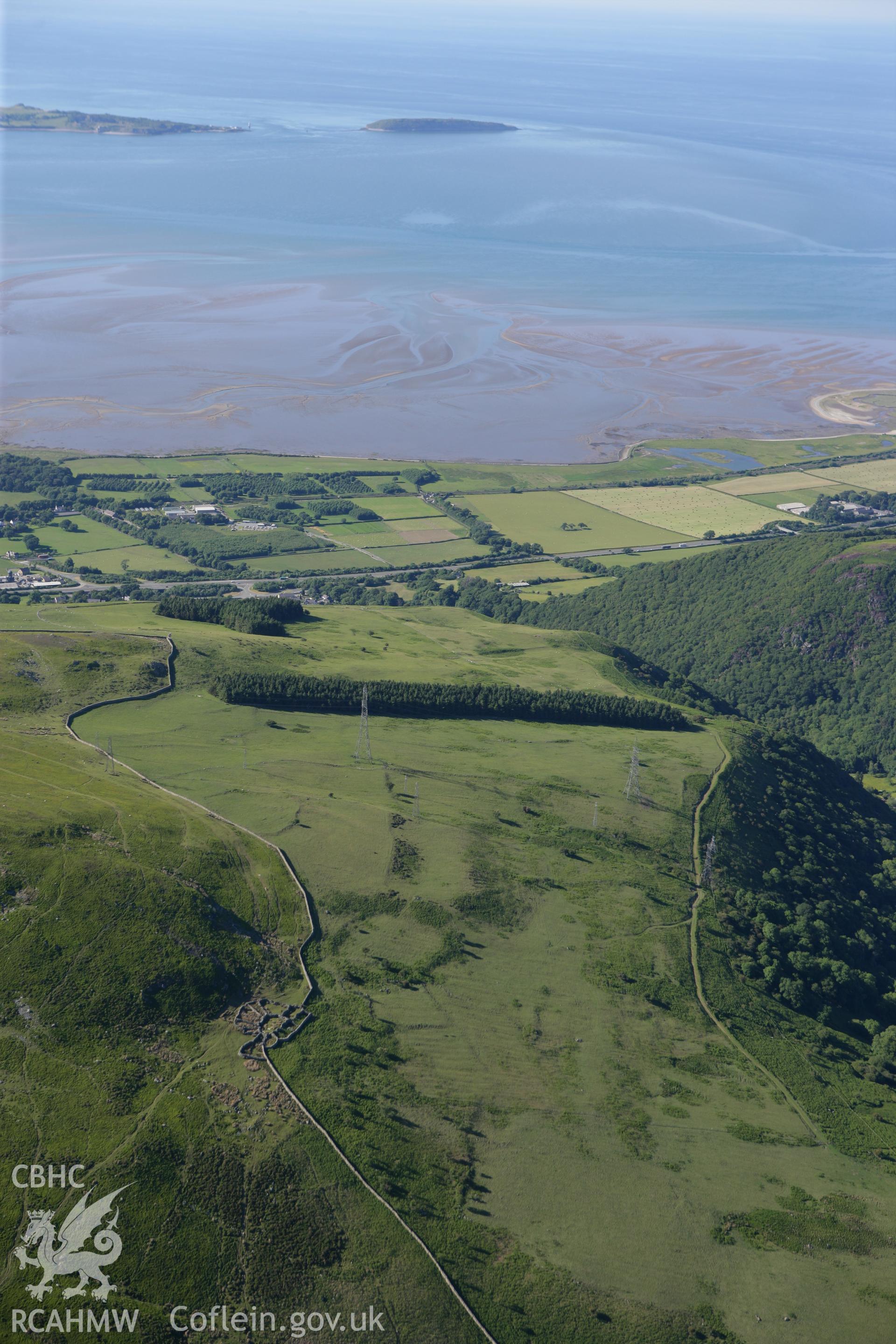 RCAHMW colour oblique photograph of enclosed hut group, Cae'r Mynydd. Taken by Toby Driver on 16/06/2010.