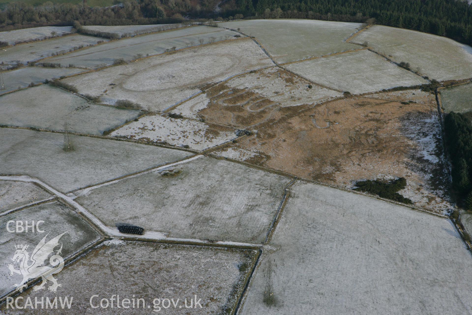 RCAHMW colour oblique photograph of Cructarw round barrow. Taken by Toby Driver on 02/12/2010.