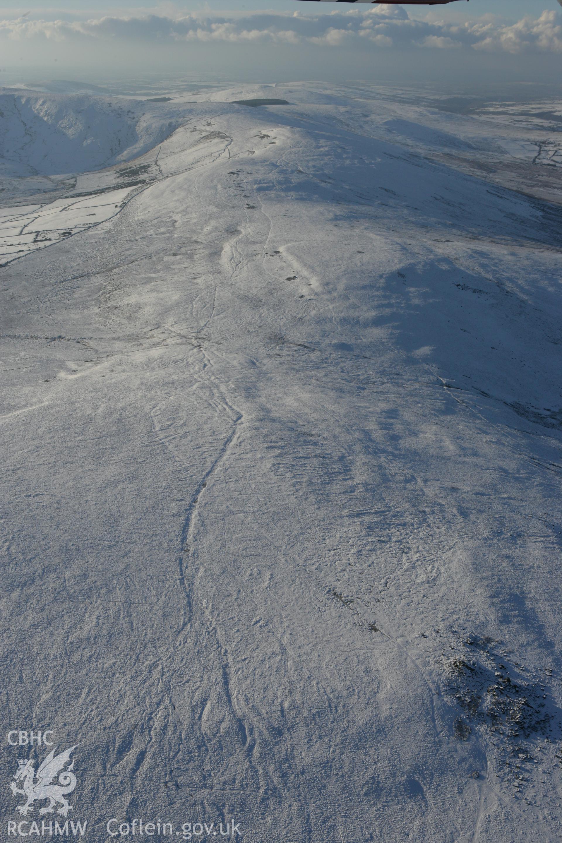 RCAHMW colour oblique photograph of Carn Bica, winter landscape looking west. Taken by Toby Driver on 01/12/2010.