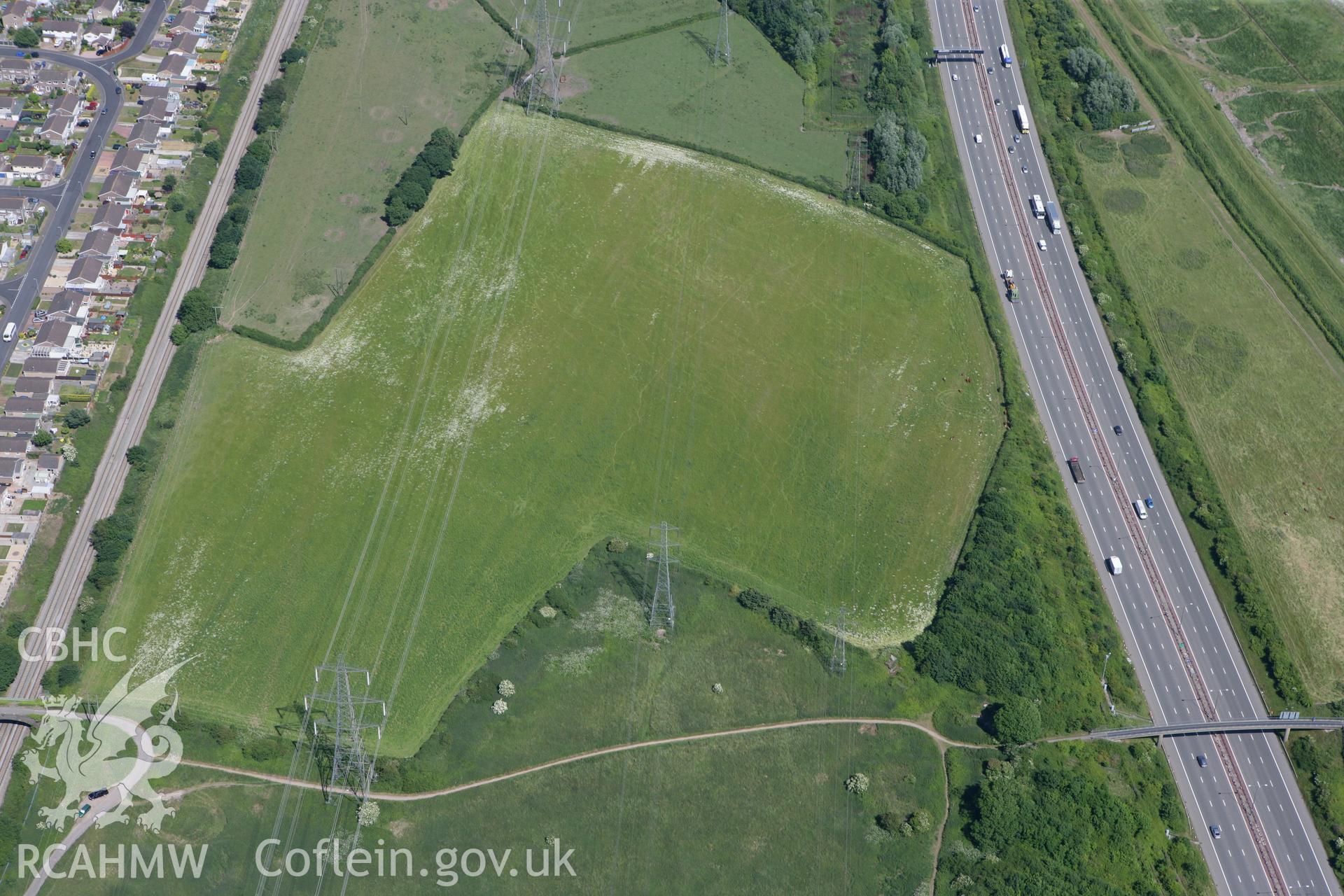 RCAHMW colour oblique photograph of Stoop Hill Cropmark Enclosure and site of probable Roman Villa, Caldicot. Taken by Toby Driver on 21/06/2010.