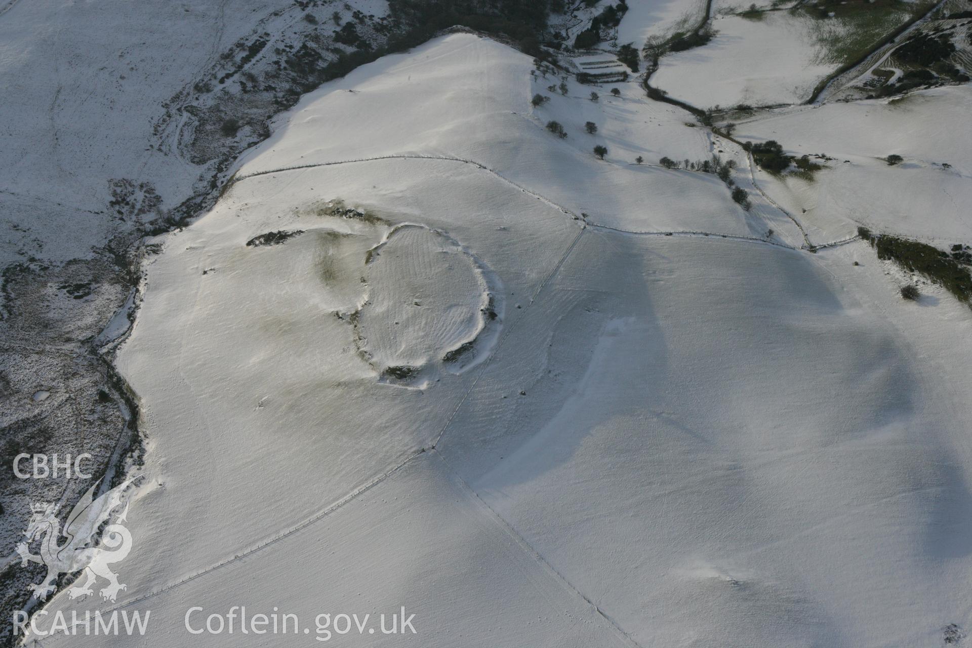 RCAHMW colour oblique photograph of Pen y Castell hillfort. Taken by Toby Driver on 02/12/2010.