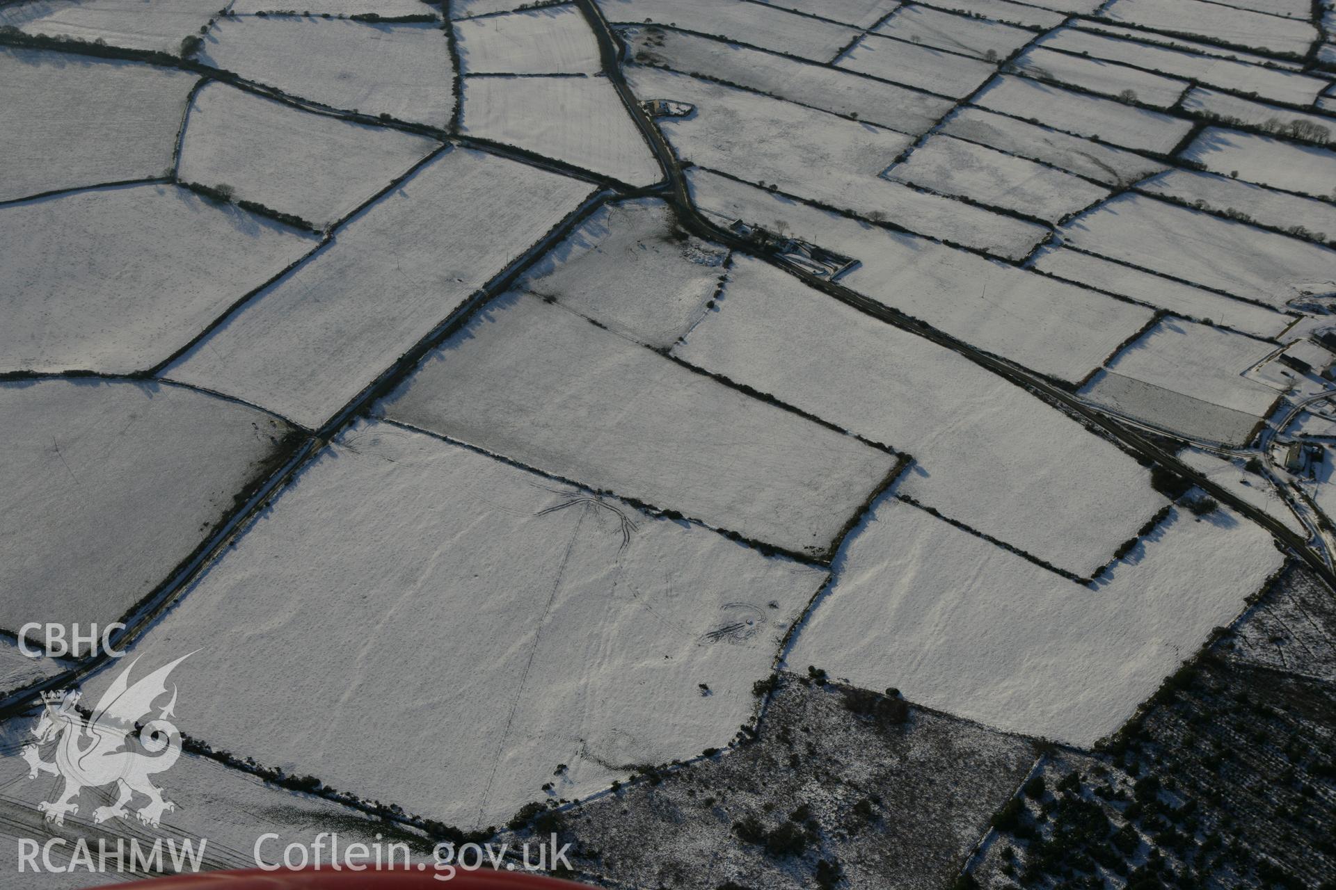 RCAHMW colour oblique photograph of Tavern Farm enclosure, Henry's moat. Taken by Toby Driver on 01/12/2010.