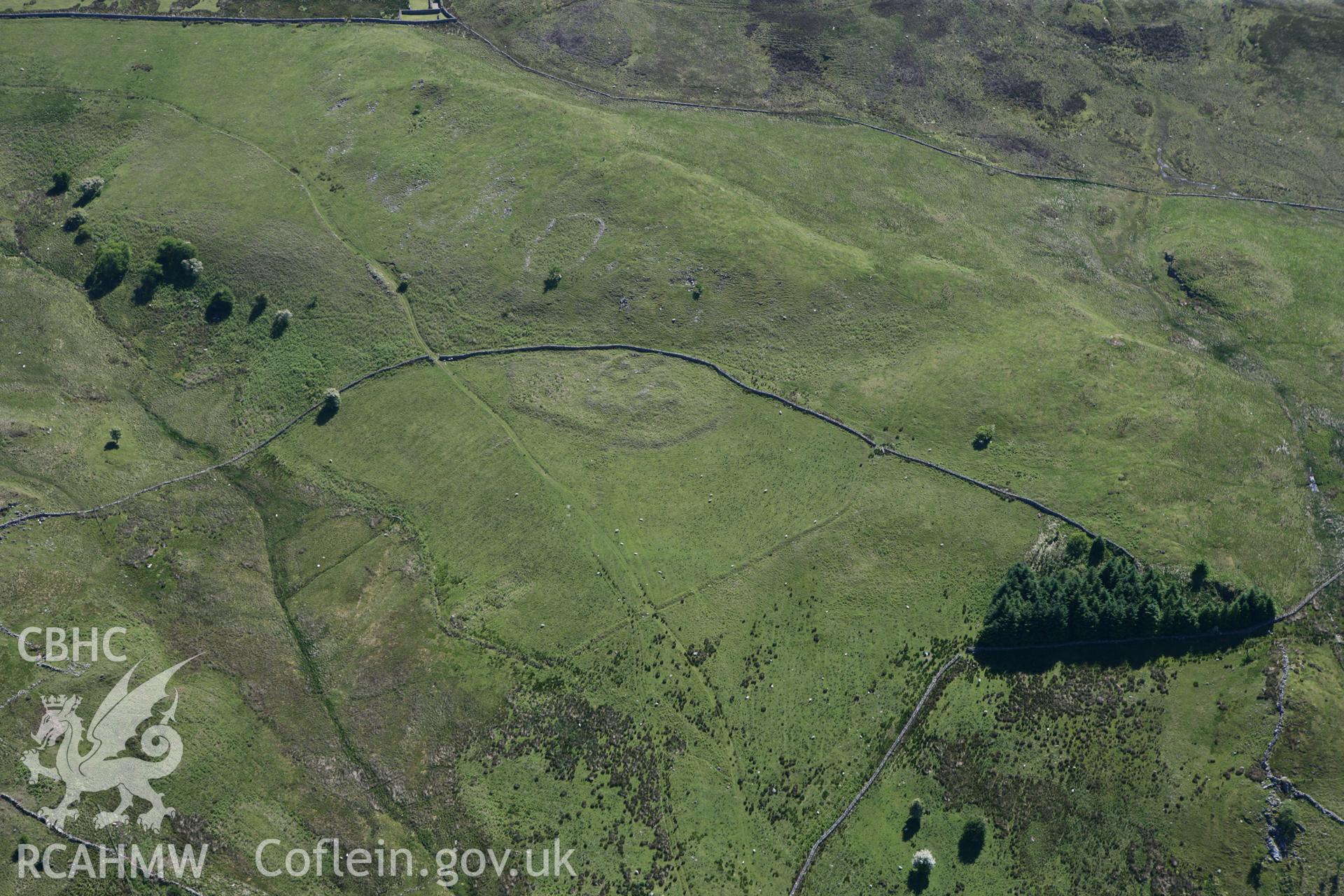 RCAHMW colour oblique photograph of Ffridd Bod-y-Fuddau Settlement. Taken by Toby Driver on 16/06/2010.