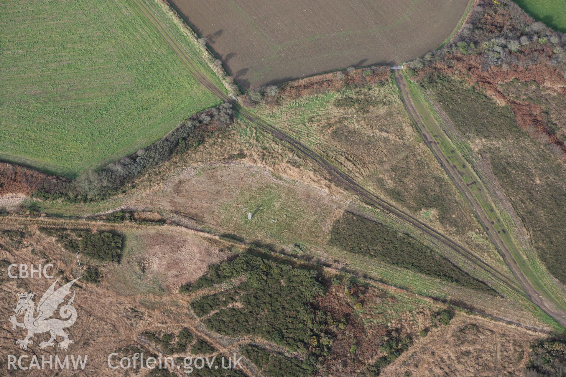 RCAHMW colour oblique photograph of Rhos-y-Clegyrn, enclosure and standing stone. Taken by Toby Driver on 16/11/2010.