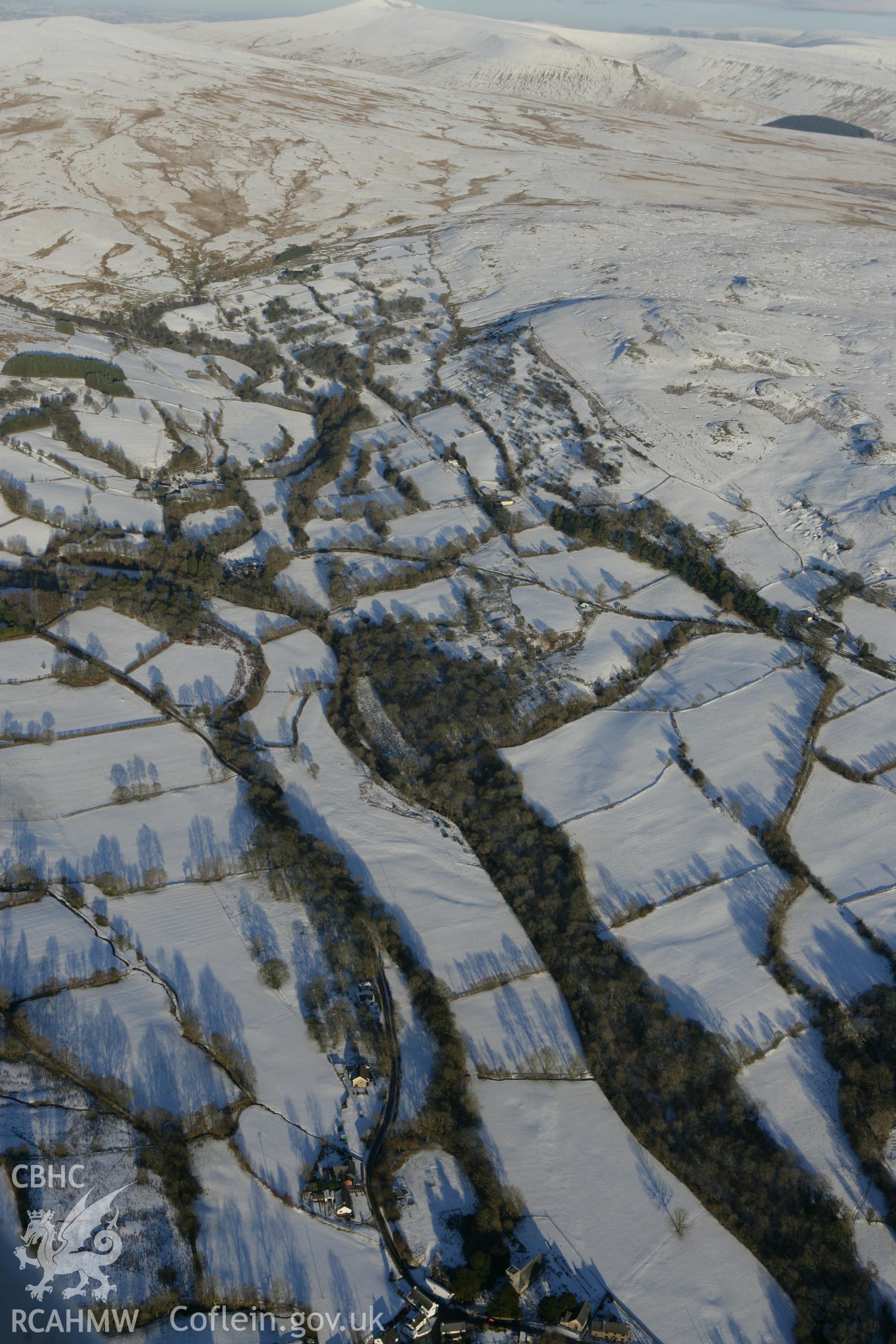 RCAHMW colour oblique photograph of landscape to the north-east of Ystradfellte, with Church of Saint Mary. Taken by Toby Driver on 08/12/2010.