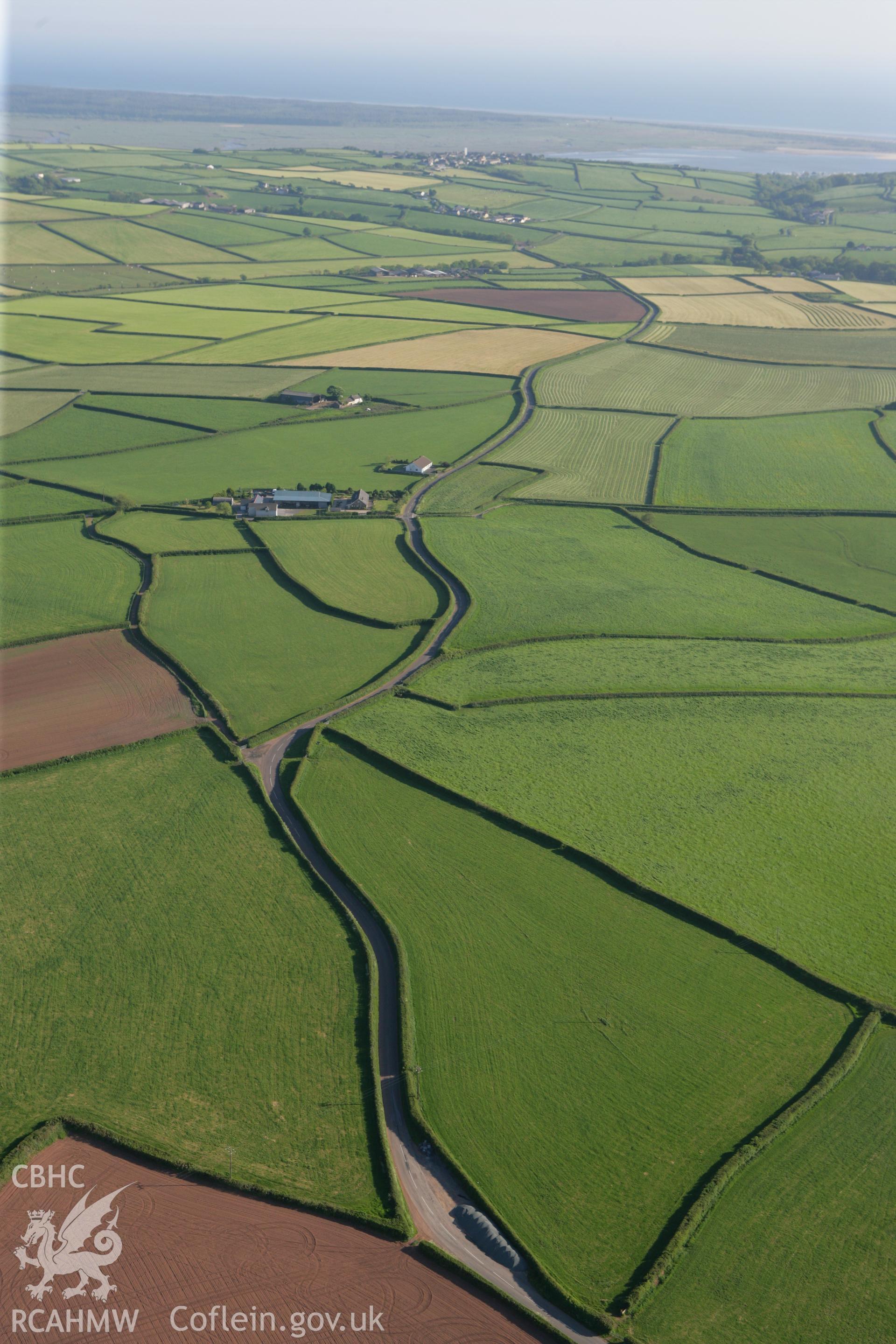 RCAHMW colour oblique photograph of Pen-yr-heol, round barrow, St. Ishmael. Taken by Toby Driver on 24/05/2010.