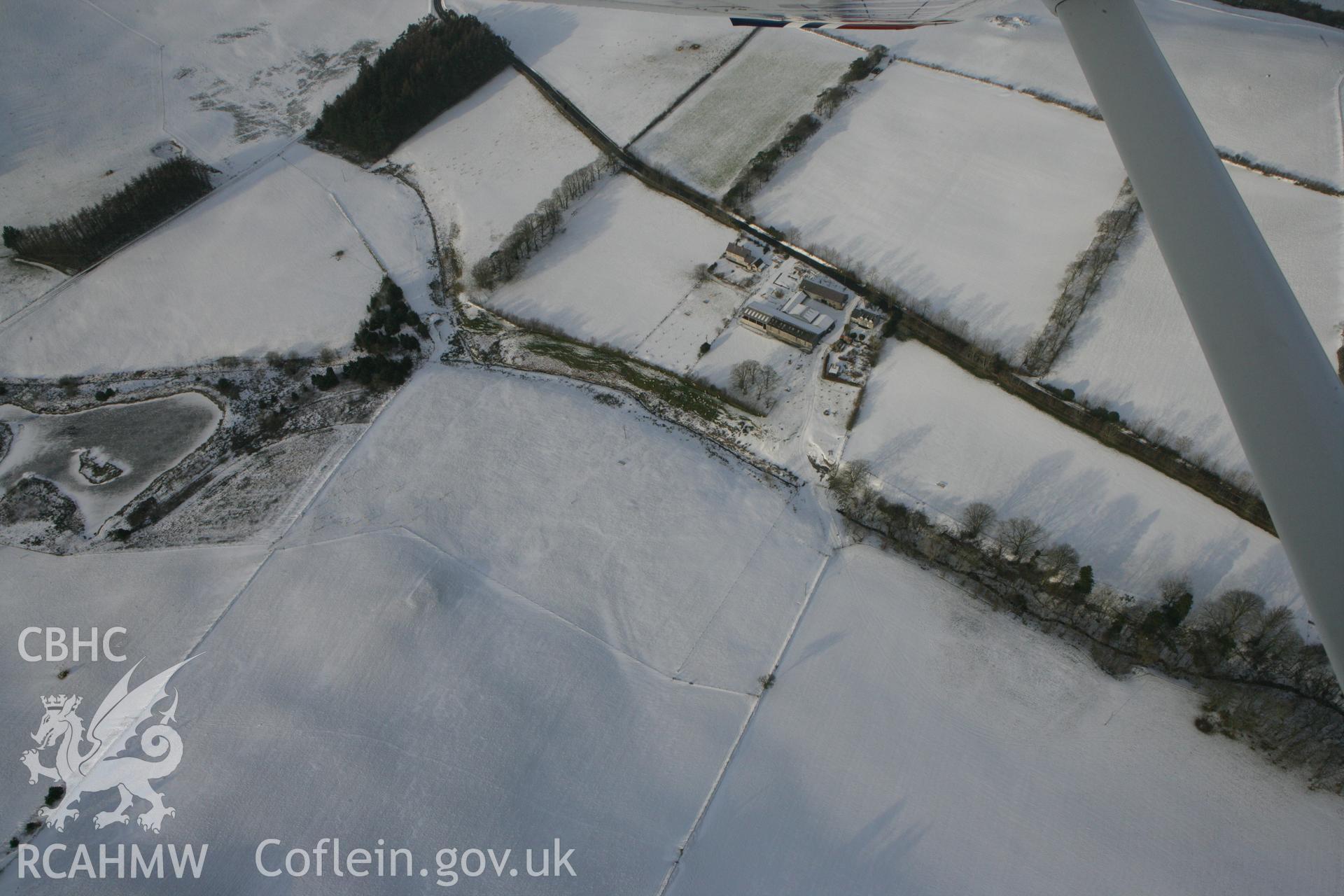 RCAHMW colour oblique photograph of Bwlchcrwys prehistoric enclosure and barrow. Taken by Toby Driver on 02/12/2010.