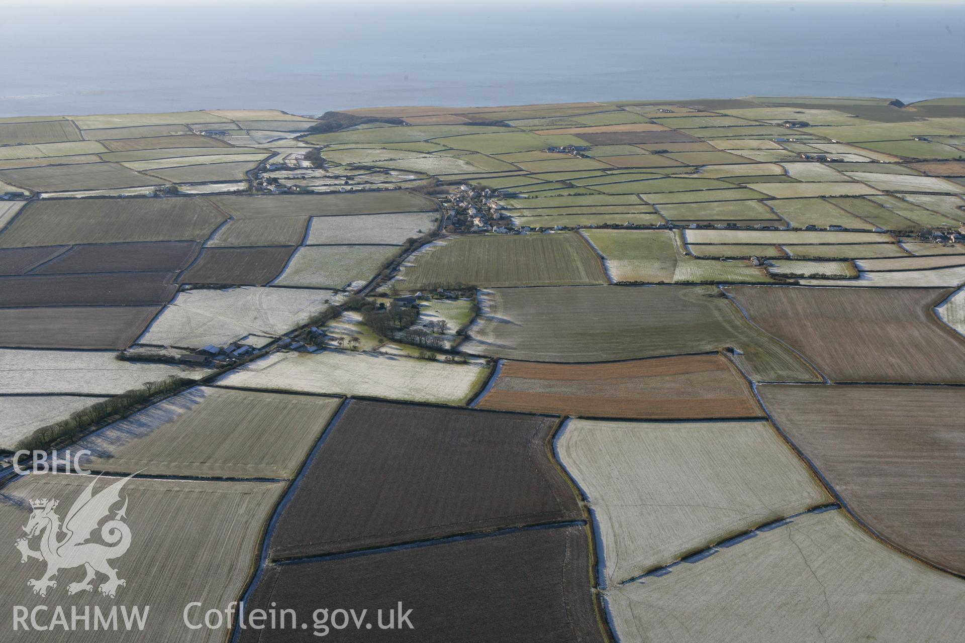 RCAHMW colour oblique photograph of Monknash Grange, distant landscape from the north-east. Taken by Toby Driver on 08/12/2010.