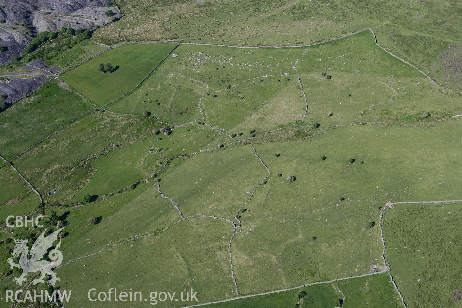 RCAHMW colour oblique photograph of Moel Faban, enclosed hut group. Taken by Toby Driver on 16/06/2010.