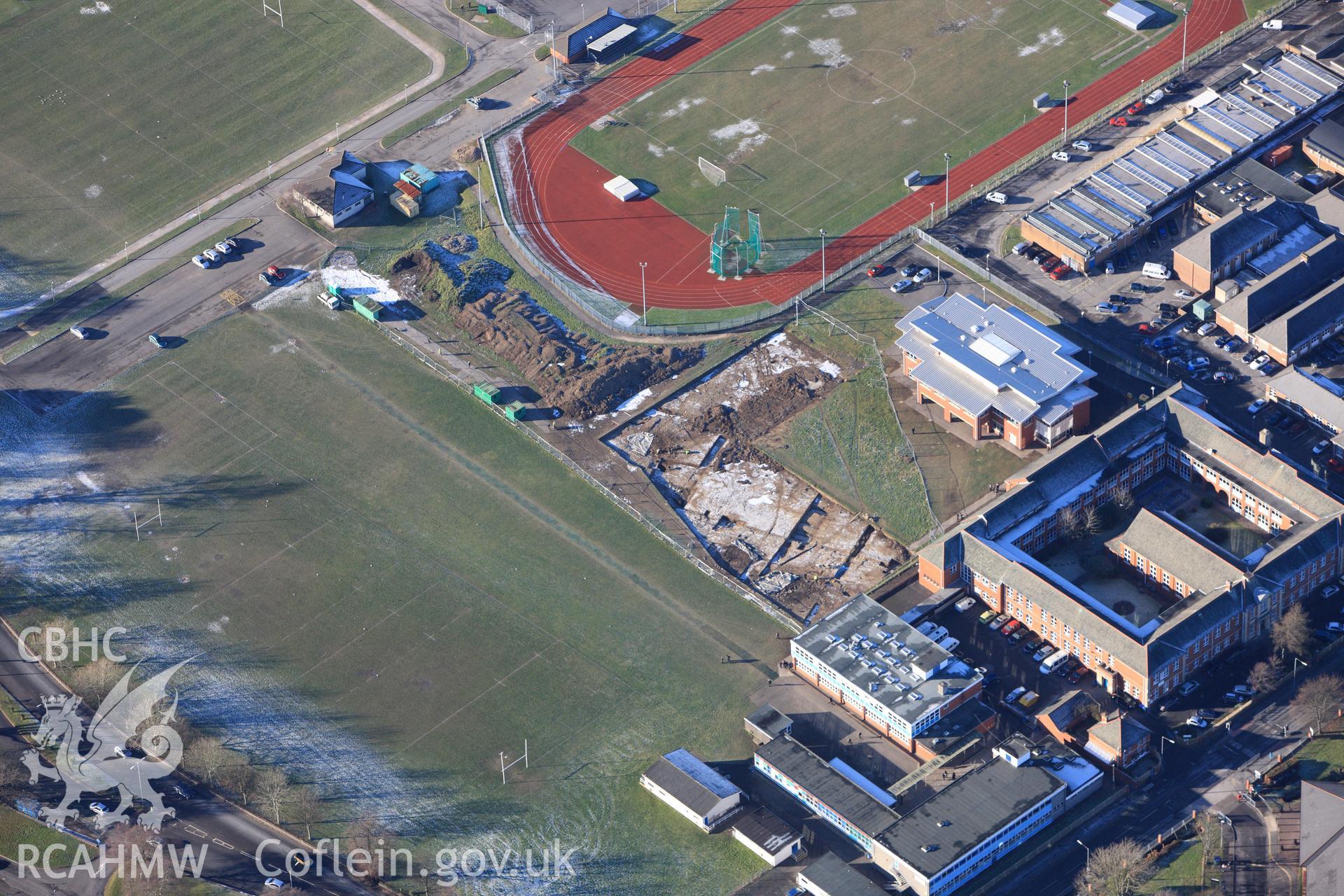 RCAHMW colour oblique photograph of Neath Auxiliary Fort, showing excavations. Taken by Toby Driver on 08/12/2010.