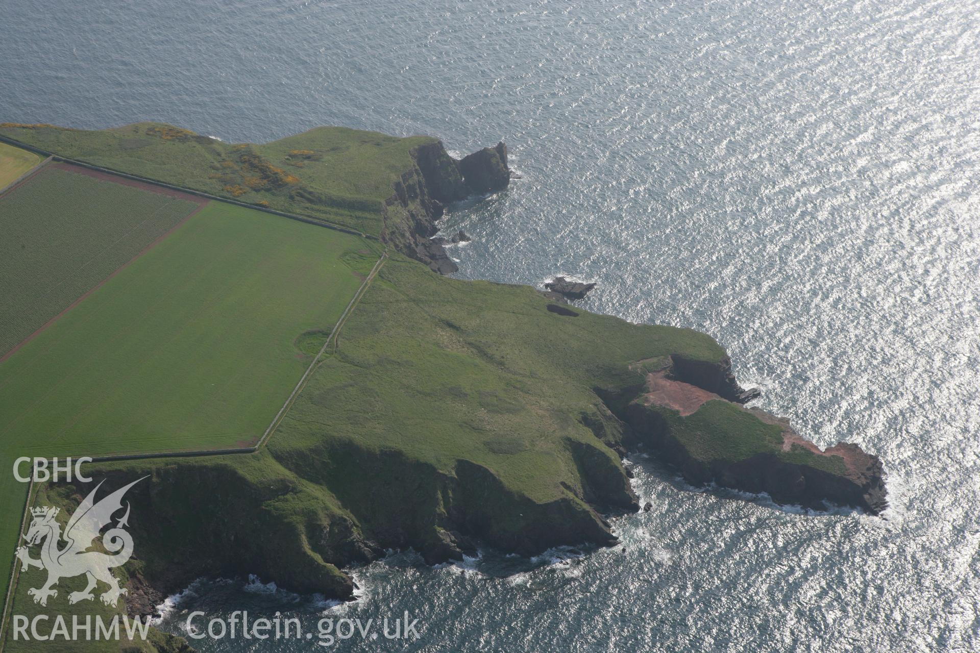 RCAHMW colour oblique photograph of Tower Point Rath promontory fort. Taken by Toby Driver on 25/05/2010.