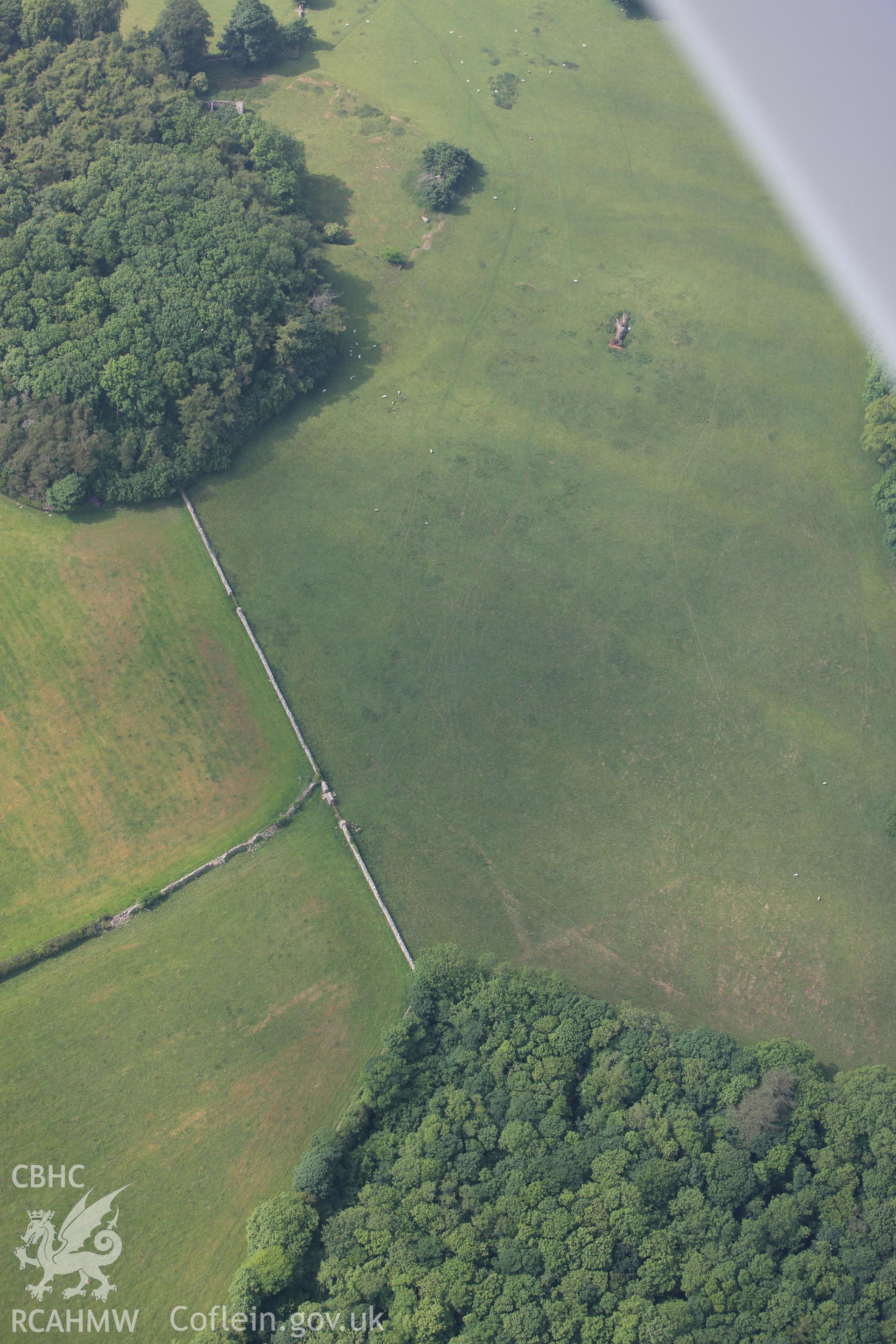 RCAHMW colour oblique photograph of Field south of Bryn yr Hen Bobl burial chamber. Taken by Toby Driver on 10/06/2010.