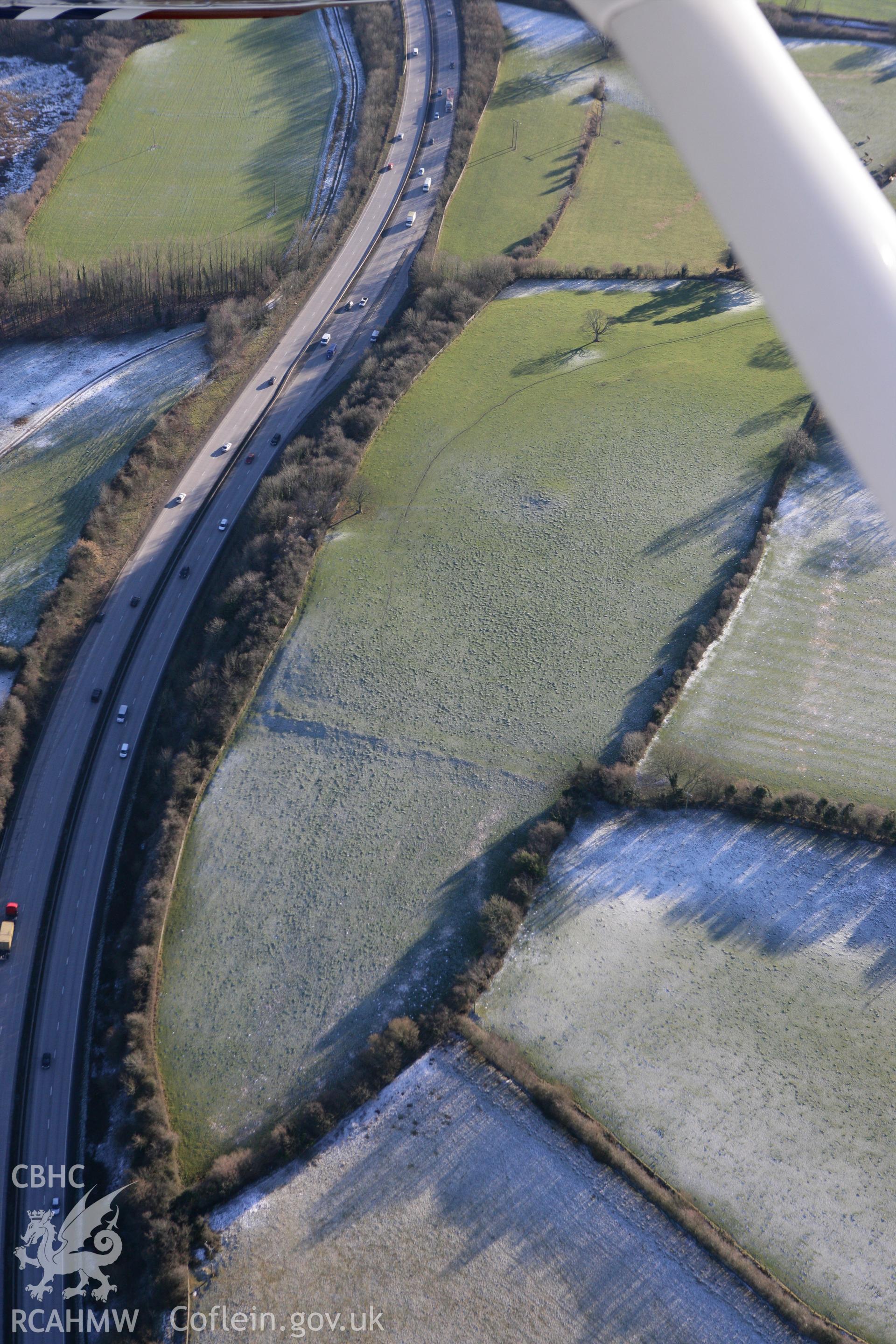 RCAHMW colour oblique photograph of St-y-Nyll barrow. Taken by Toby Driver on 08/12/2010.