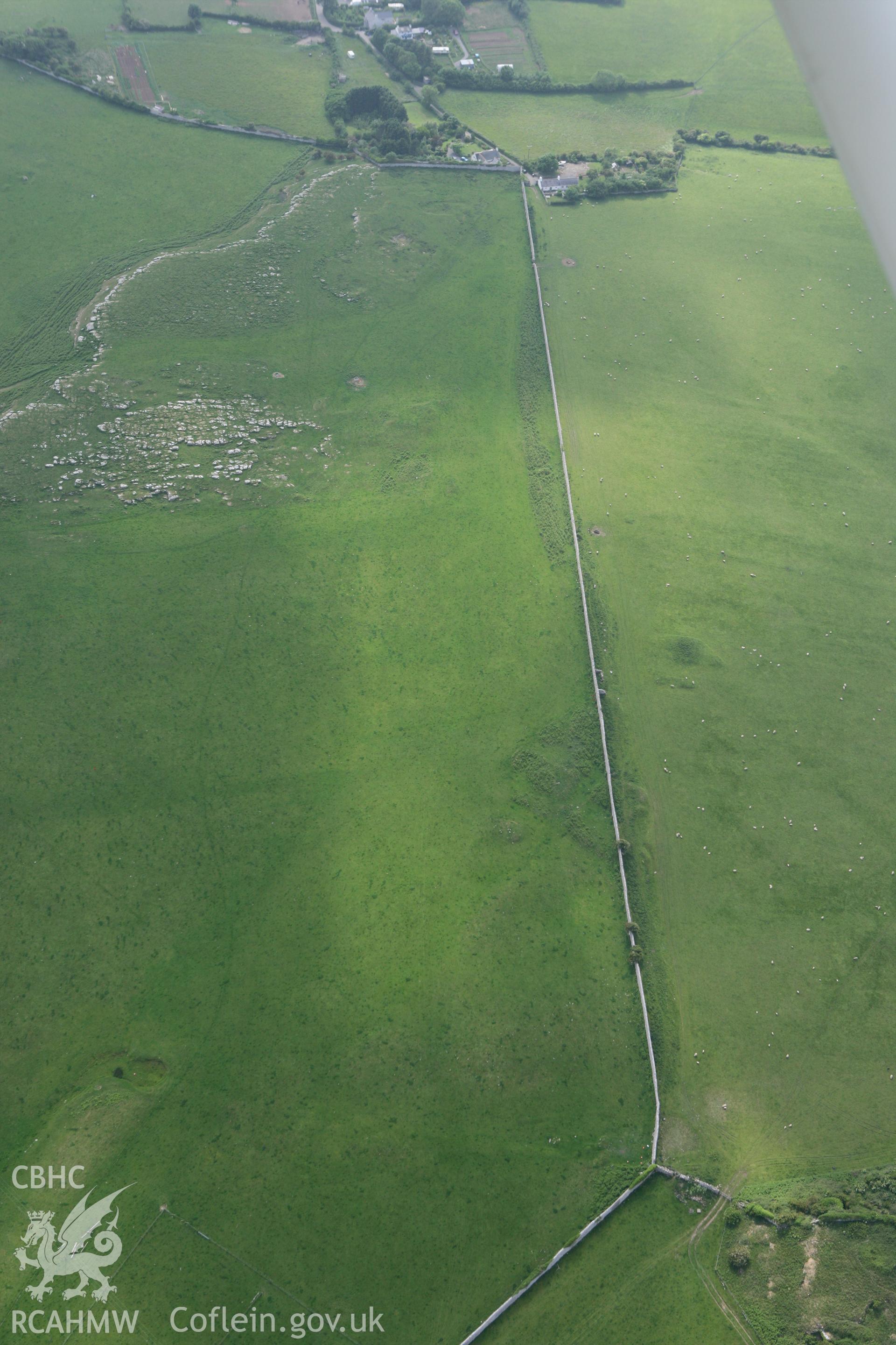 RCAHMW colour oblique photograph of Penmon deer park hut groups and terraces. Taken by Toby Driver on 10/06/2010.