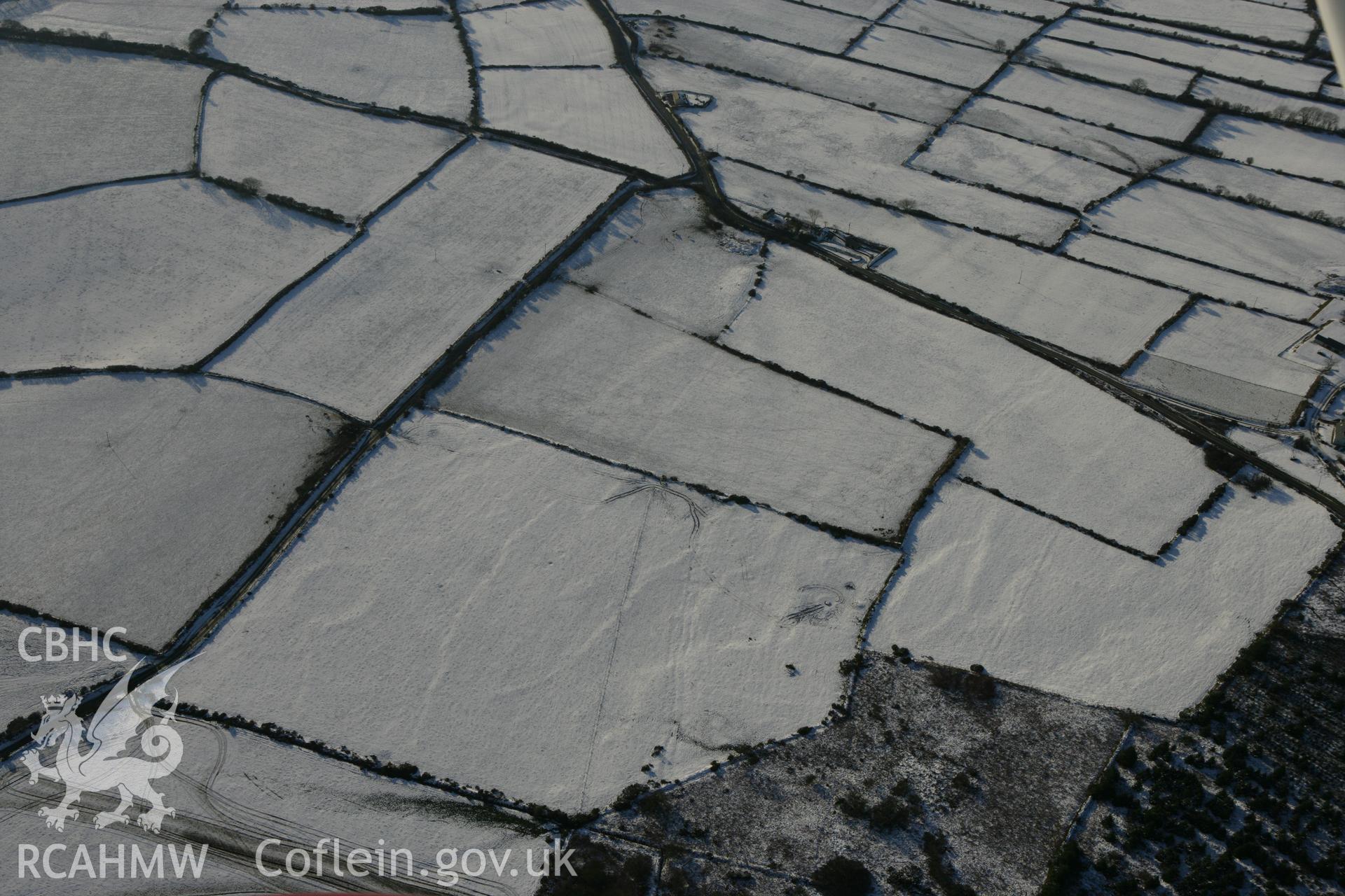 RCAHMW colour oblique photograph of Tavern Farm enclosure, Henry's moat. Taken by Toby Driver on 01/12/2010.