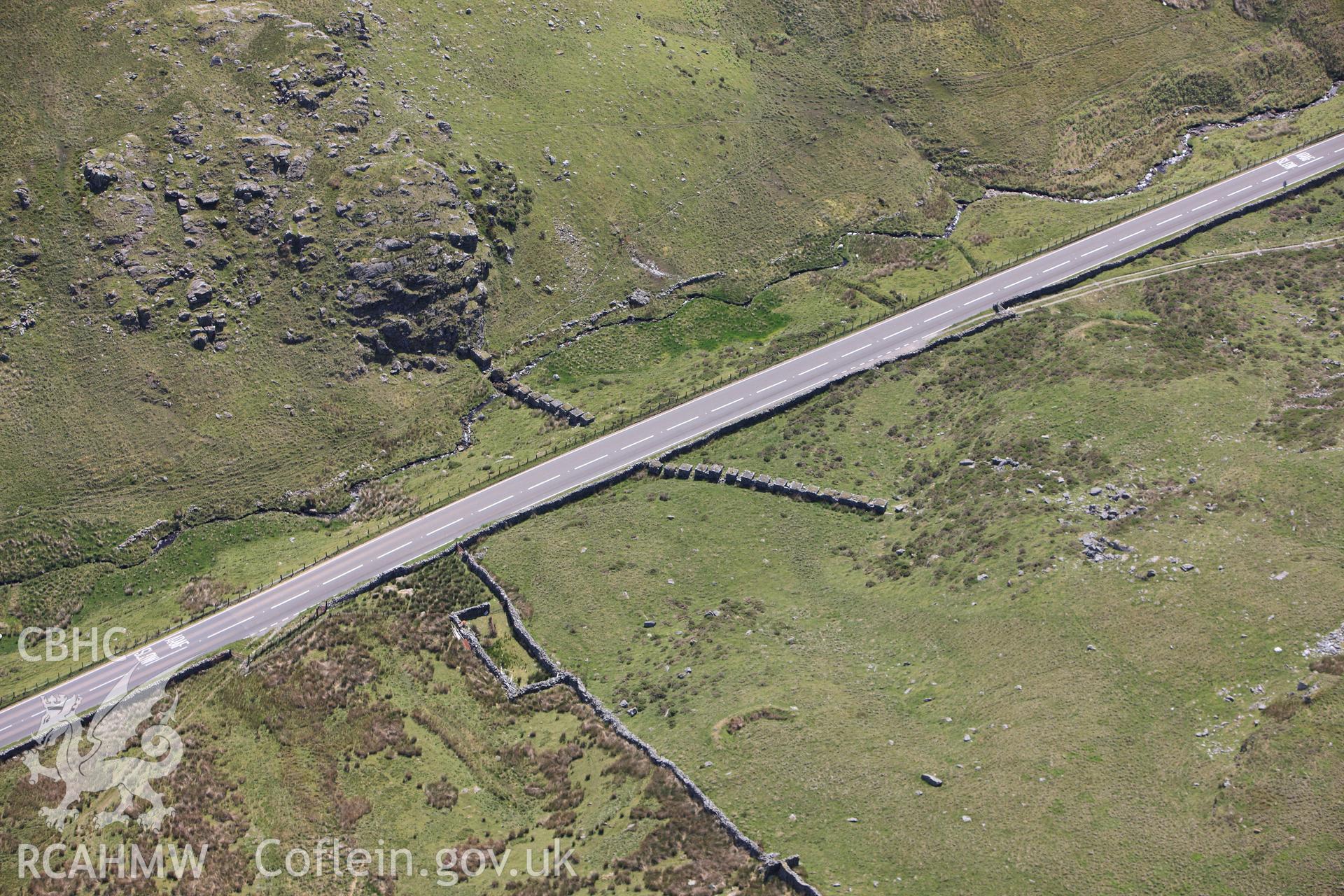 RCAHMW colour oblique photograph of Anti-Invasion defence east of Cae'r-tyddyn. Taken by Toby Driver on 16/06/2010.