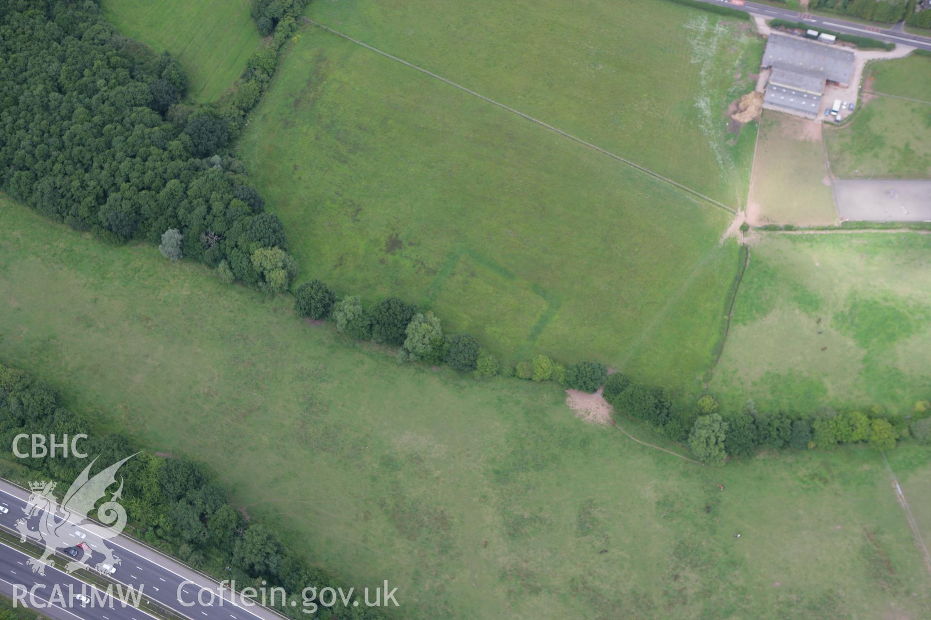 RCAHMW colour oblique photograph of Court Farm Moat. Taken by Toby Driver on 29/07/2010.