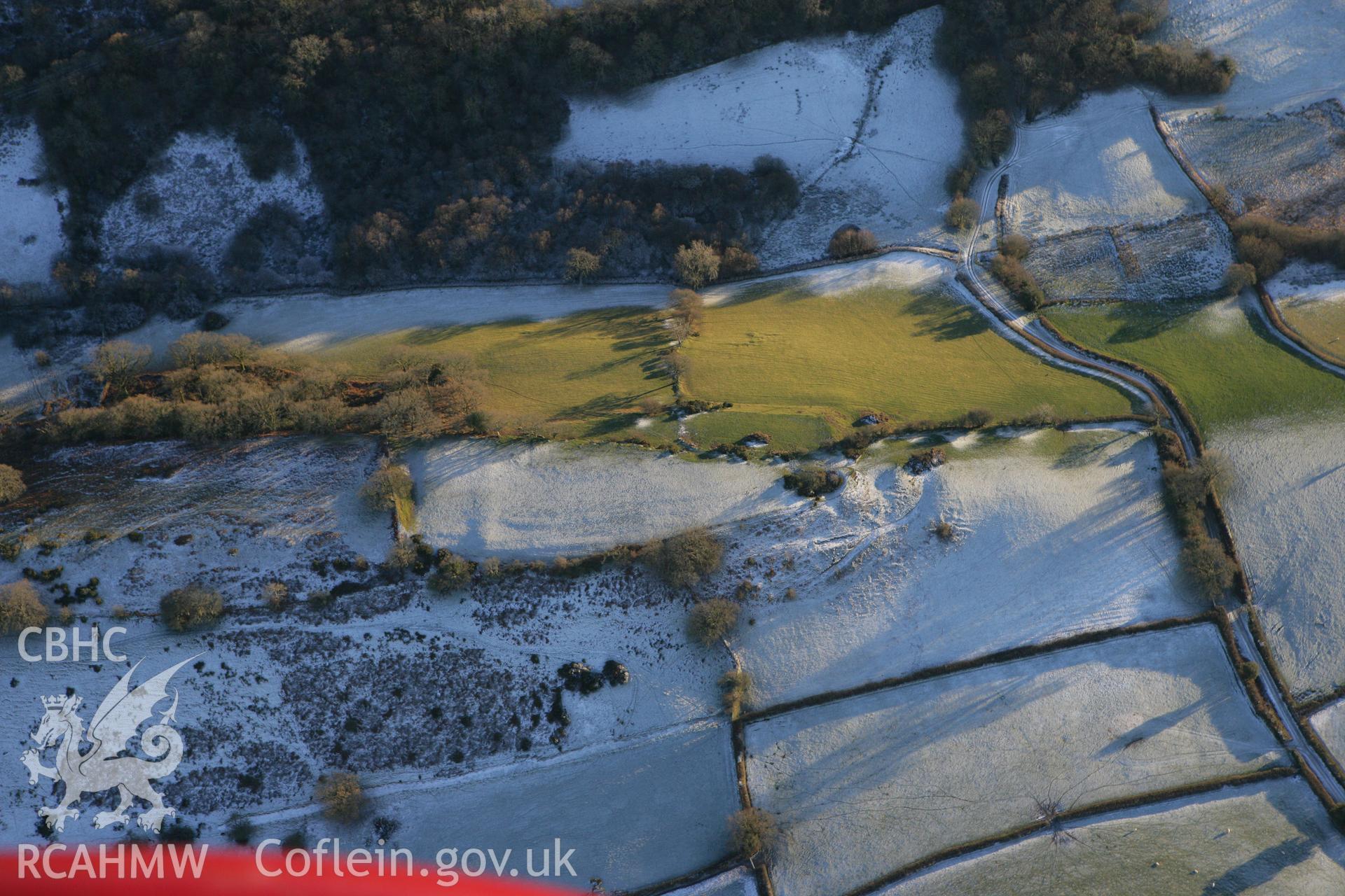 RCAHMW colour oblique photograph of Llwyndu camp. Taken by Toby Driver on 08/12/2010.