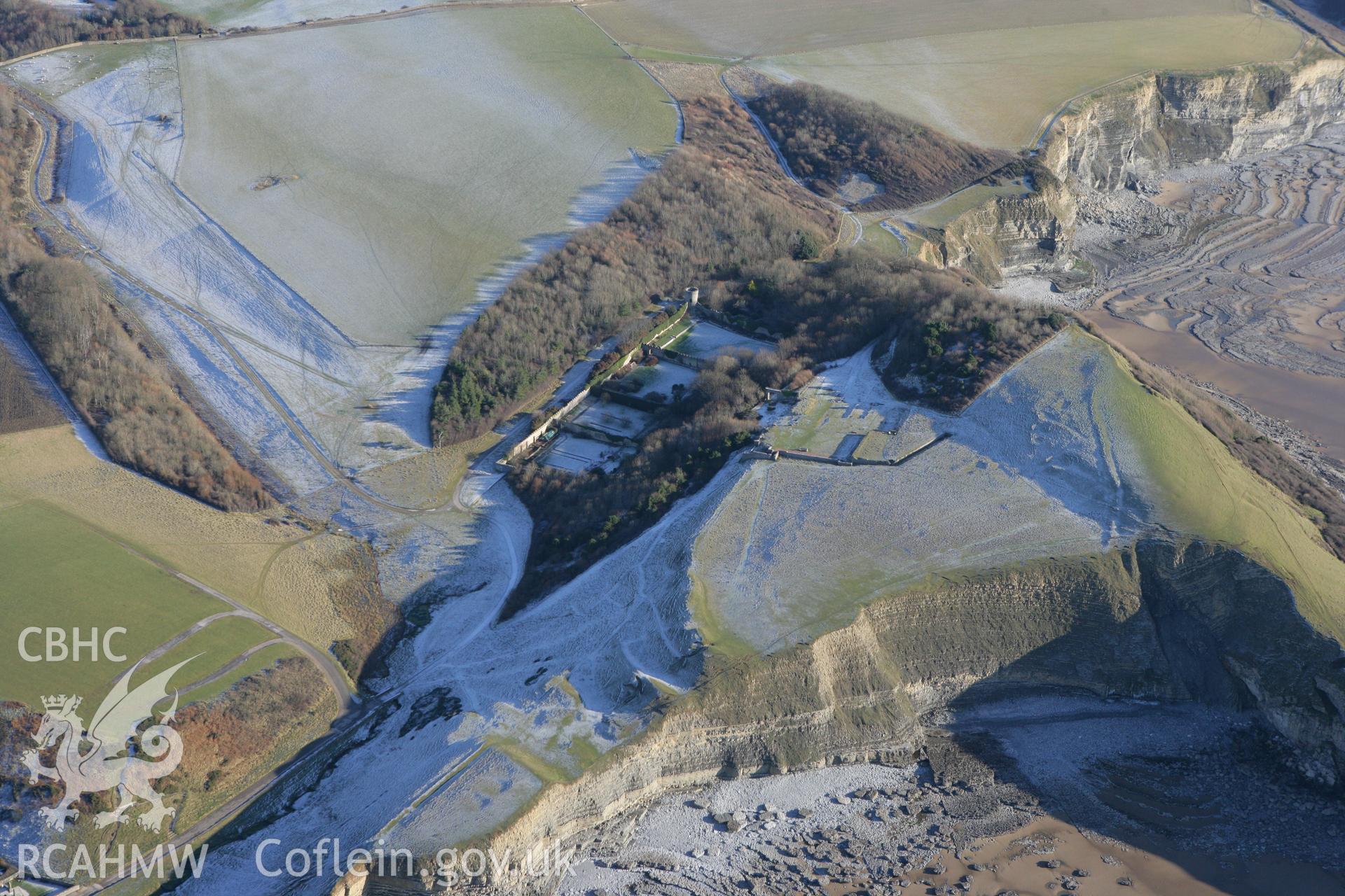 RCAHMW colour oblique photograph of Dunraven Hillfort, and south Glamorgan coast. Taken by Toby Driver on 08/12/2010.