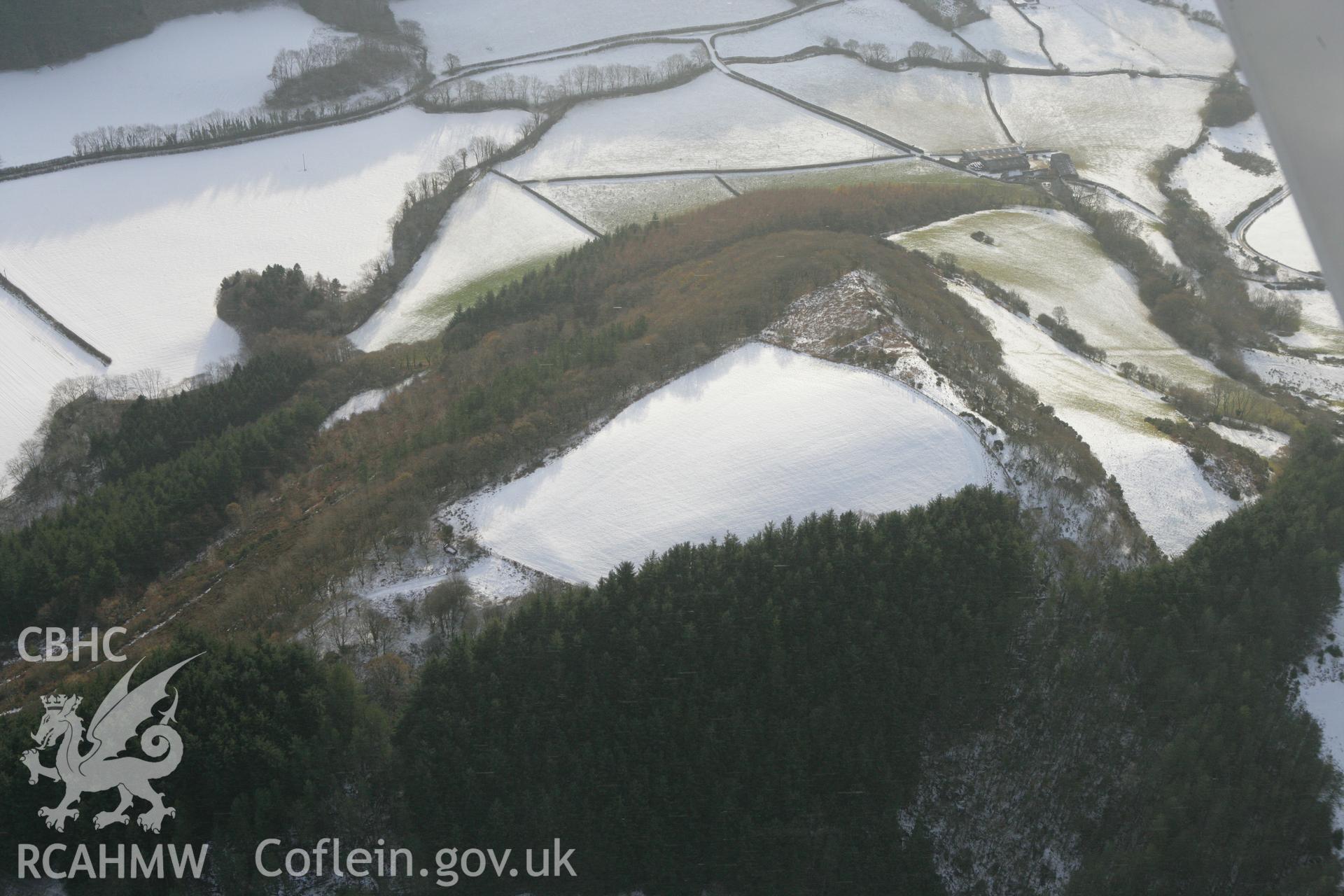 RCAHMW colour oblique photograph of Banc y Castell hillfort (Castell Goginan Fach). Taken by Toby Driver on 02/12/2010.