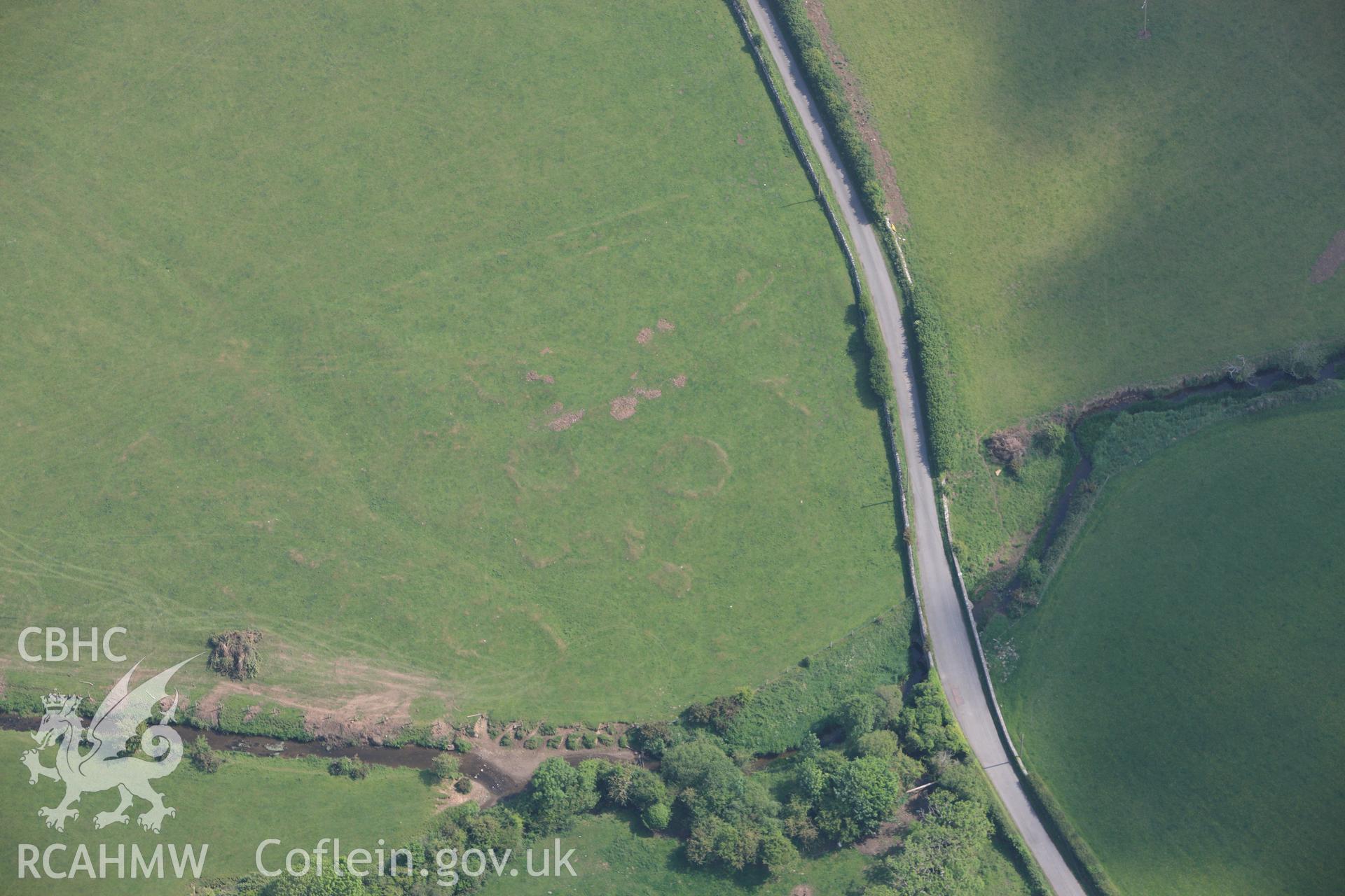 RCAHMW colour oblique photograph of Hut circles to north,. Taken by Toby Driver on 10/06/2010.