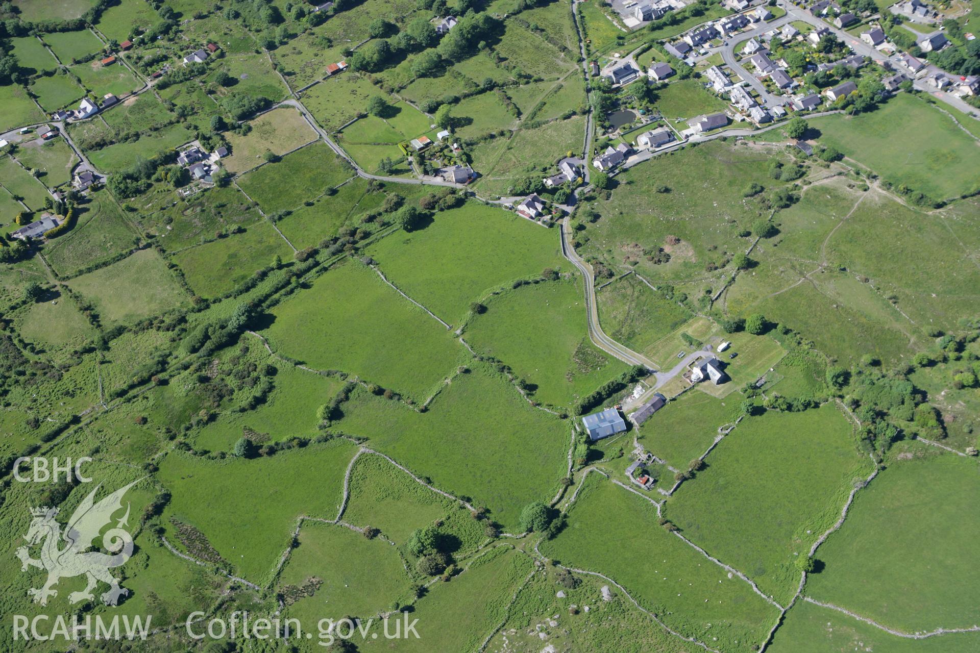 RCAHMW colour oblique photograph of Coed-y-Brain Hut Group and Field System, east of Coed-y-Brain. Taken by Toby Driver on 16/06/2010.