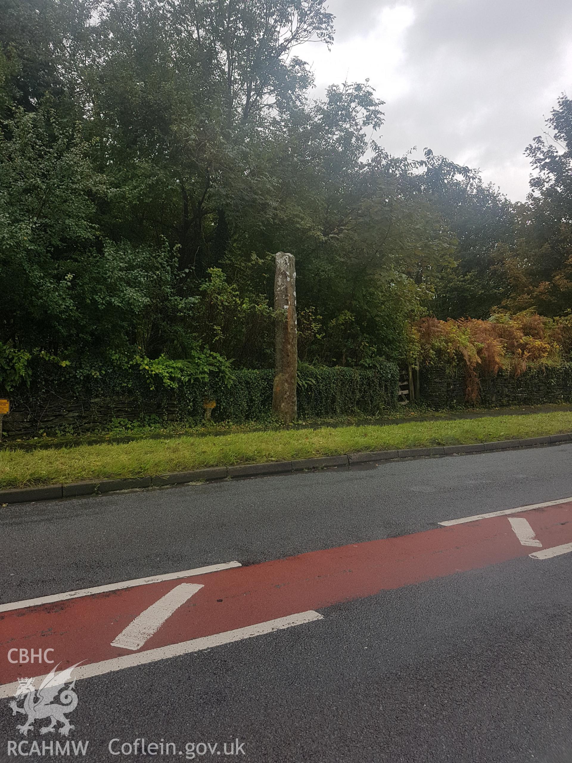 Distant view of standing stone at Pentrefelin. Photographed by Helen Rowe of RCAHMW on 10th October 2020.