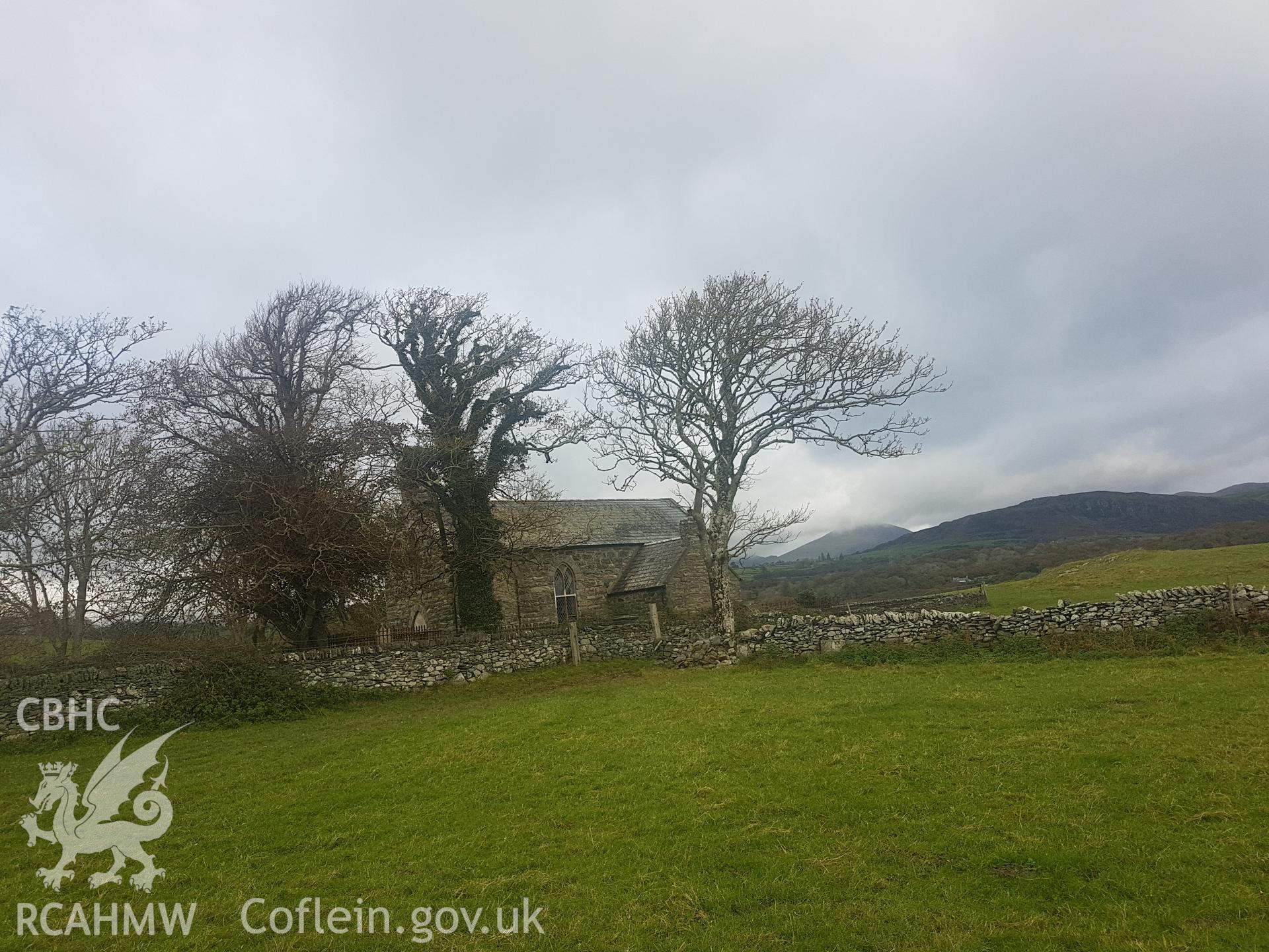 Distant view of St Cynhaiarn church. Photographed by Helen Rowe of RCAHMW on 10th October 2020.