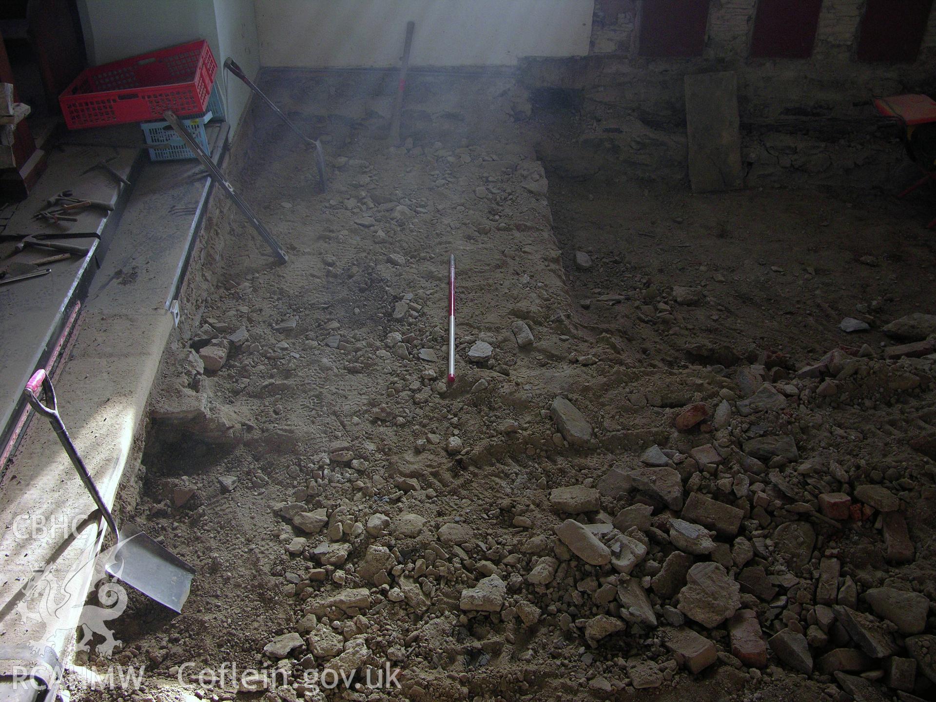 Digital colour photograph showing view of transept from pulpit after reduction in levels, scale 1x1m - part of an archaeological watching brief for St Michaels Church, Trefeglwys, Powys (CAP Report 602) by Chris E. Smith.