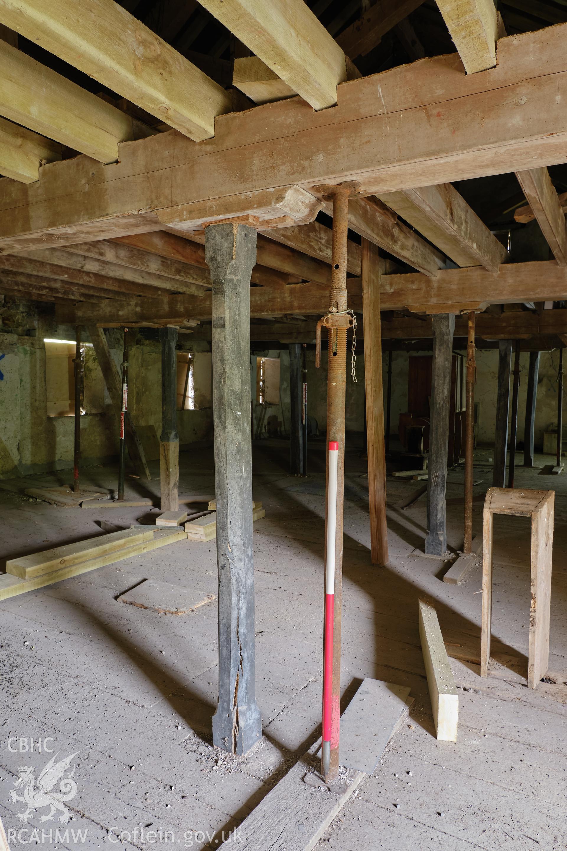 Colour photograph showing Blackpool Mill - 3rd floor, detail of timber post, looking NE. Produced as part of Historic Building Recording for Blackpool Mill, carried out by Richard Hayman, June 2021.