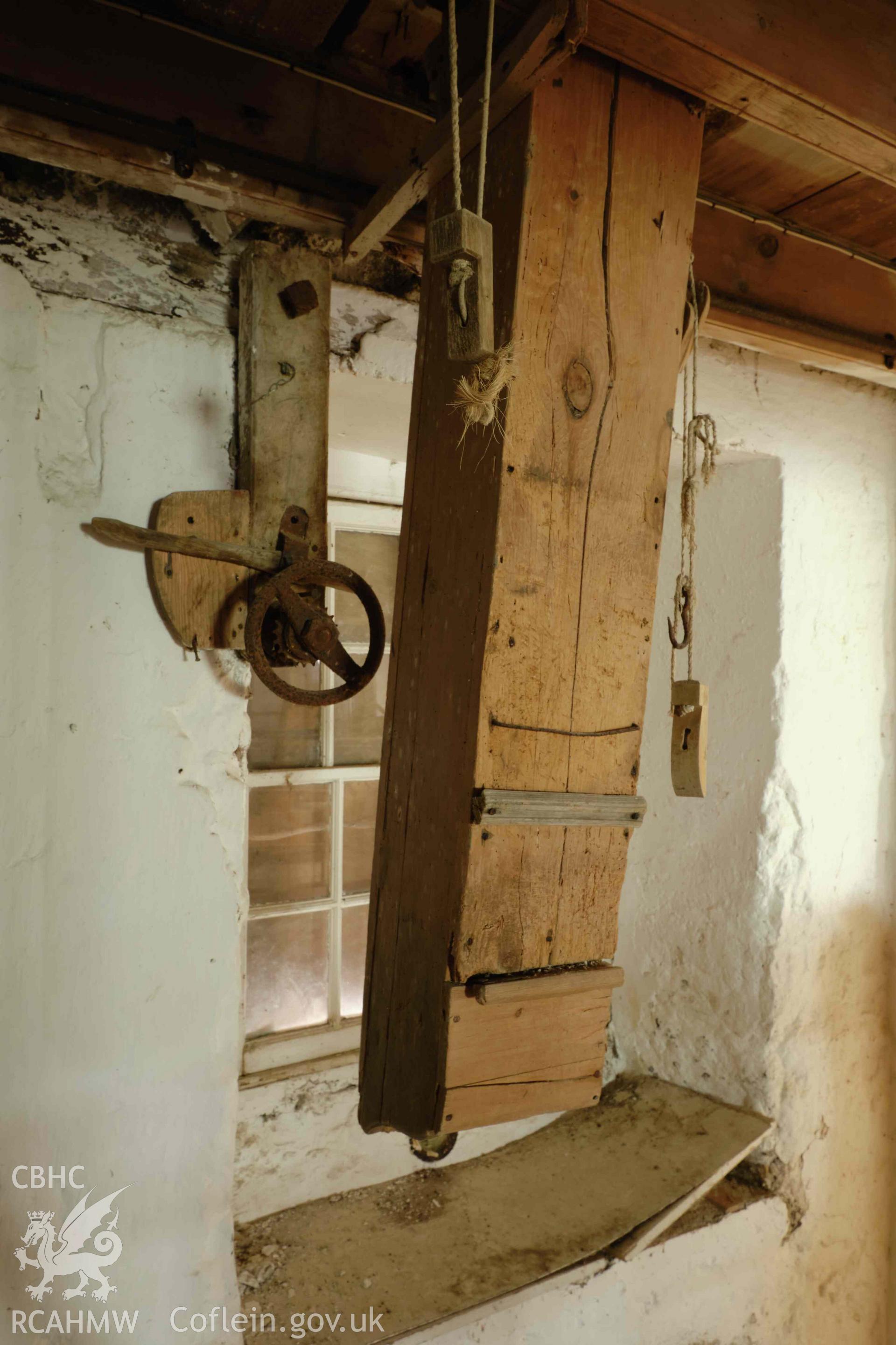 Colour photograph showing Blackpool Mill - ground floor, chute for filling sacks, looking S. Produced as part of Historic Building Recording for Blackpool Mill, carried out by Richard Hayman, June 2021.