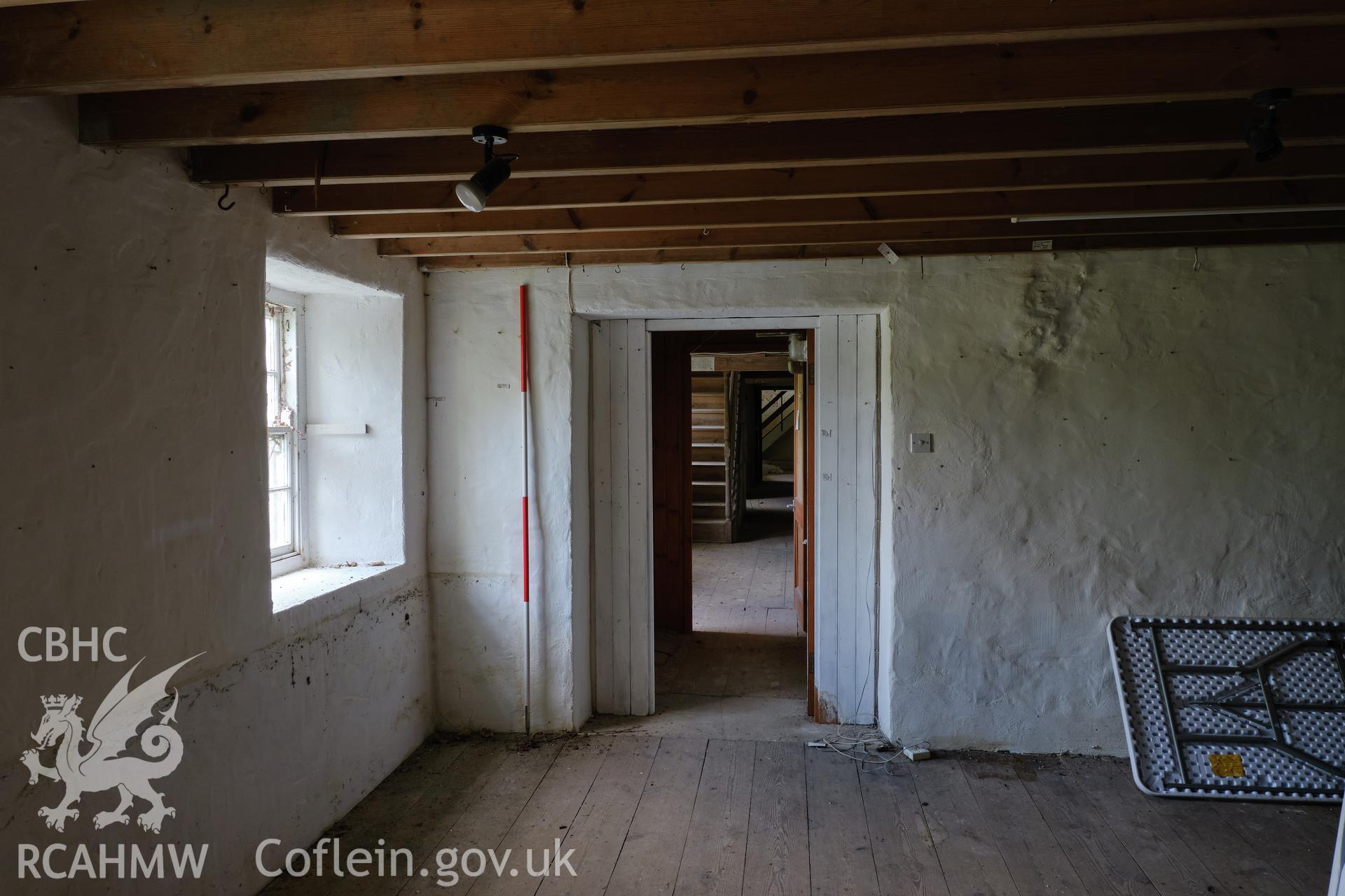 Colour photograph showing Blackpool Mill - SW wing, ground floor, looking NE to main mill. Produced as part of Historic Building Recording for Blackpool Mill, carried out by Richard Hayman, June 2021.