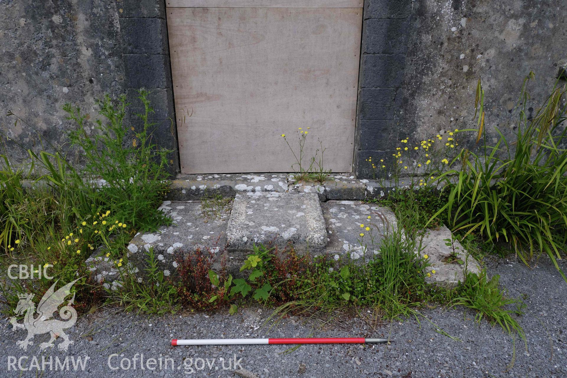 Colour photograph showing Blackpool Mill - concrete steps to SE wall main entrance. Produced as part of Historic Building Recording for Blackpool Mill, carried out by Richard Hayman, June 2021.