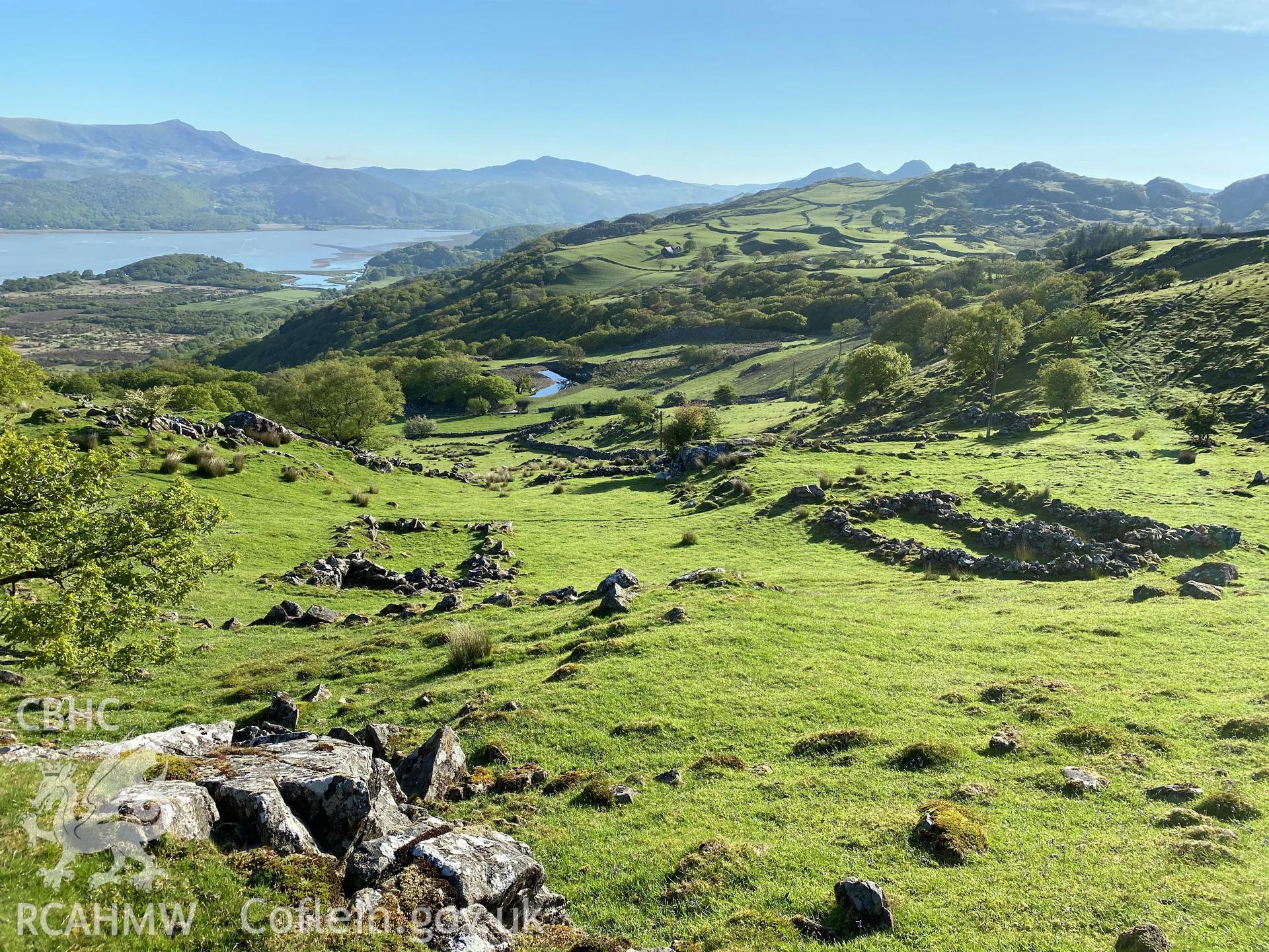 Digital colour photograph showing Cynfannedd longhuts, general view, produced by Paul R Davis in 2021.