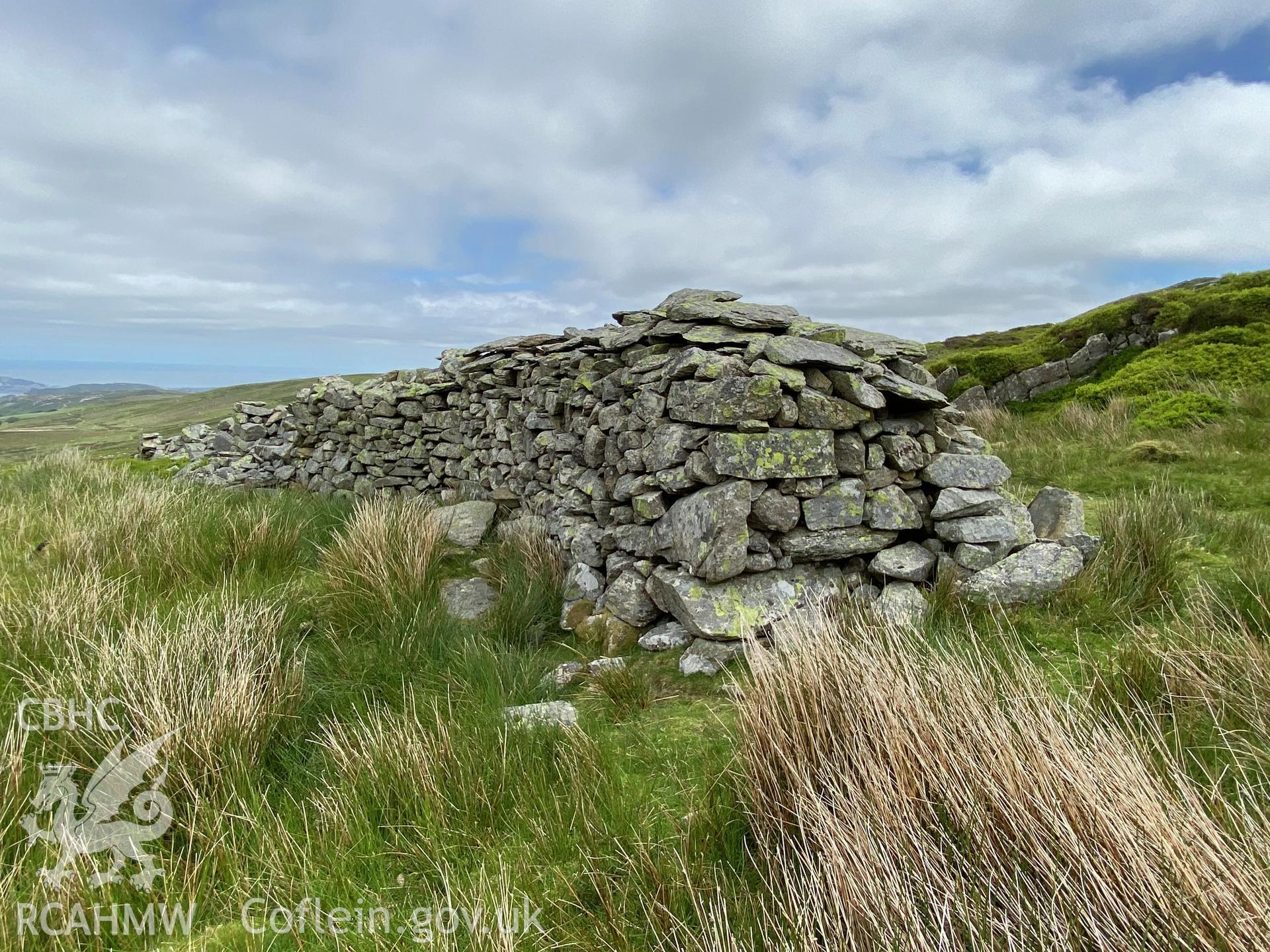 Digital colour photograph showing Talyfan peat house, produced by Paul R Davis in 2021.