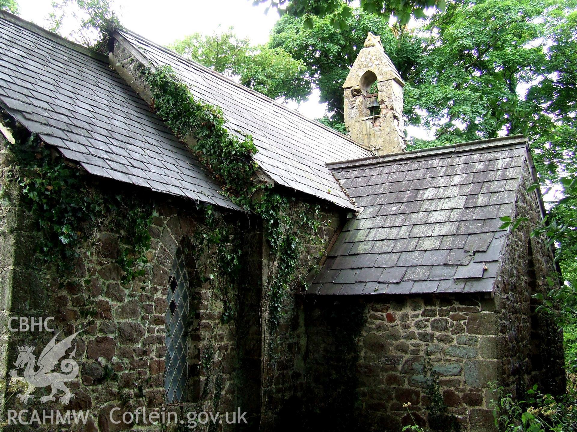 Digital colour photograph showing exterior from the north east, Castell Dwyran church.