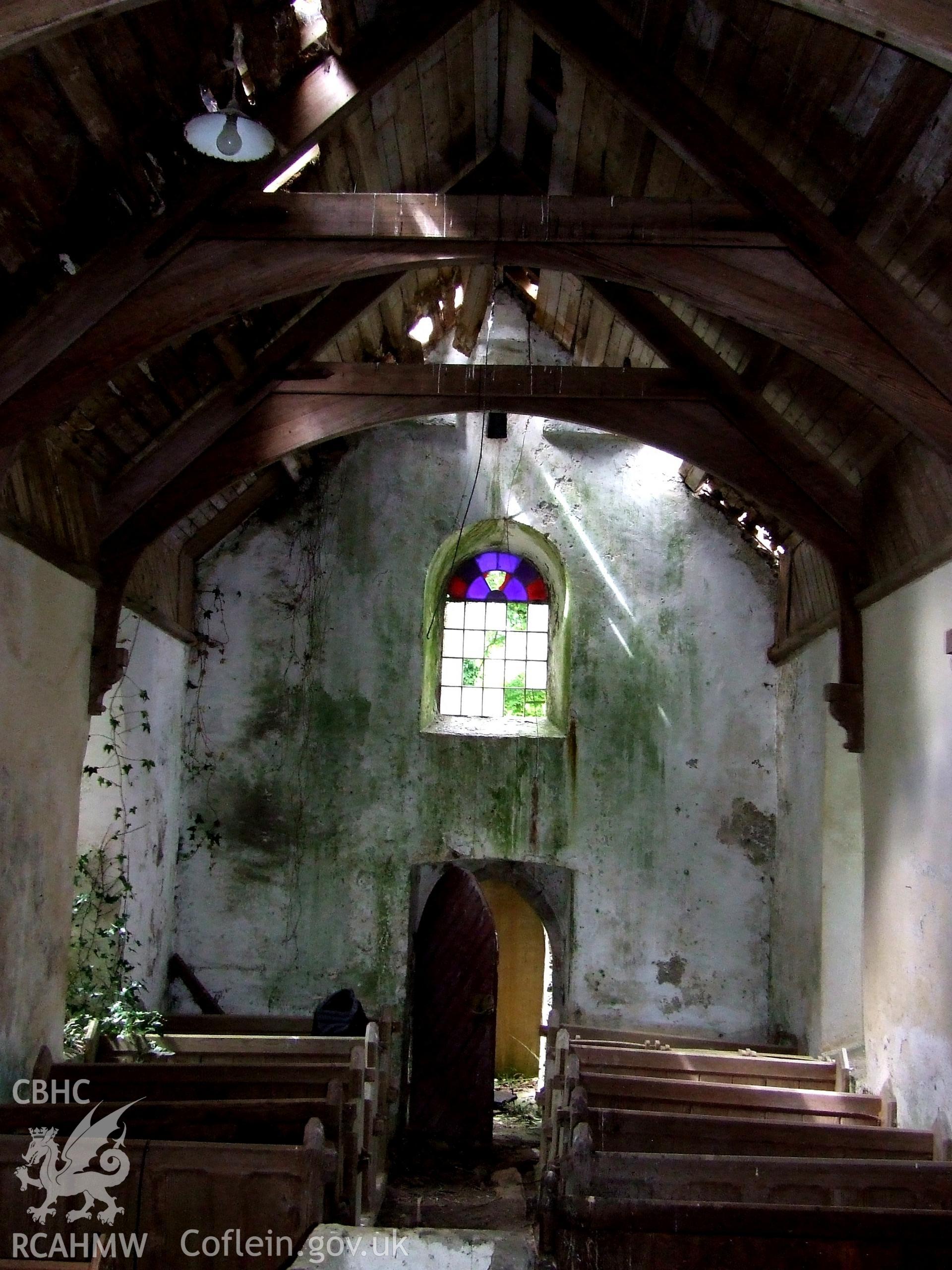 Digital colour photograph showing interior looking west from crossing, Castell Dwyran church.