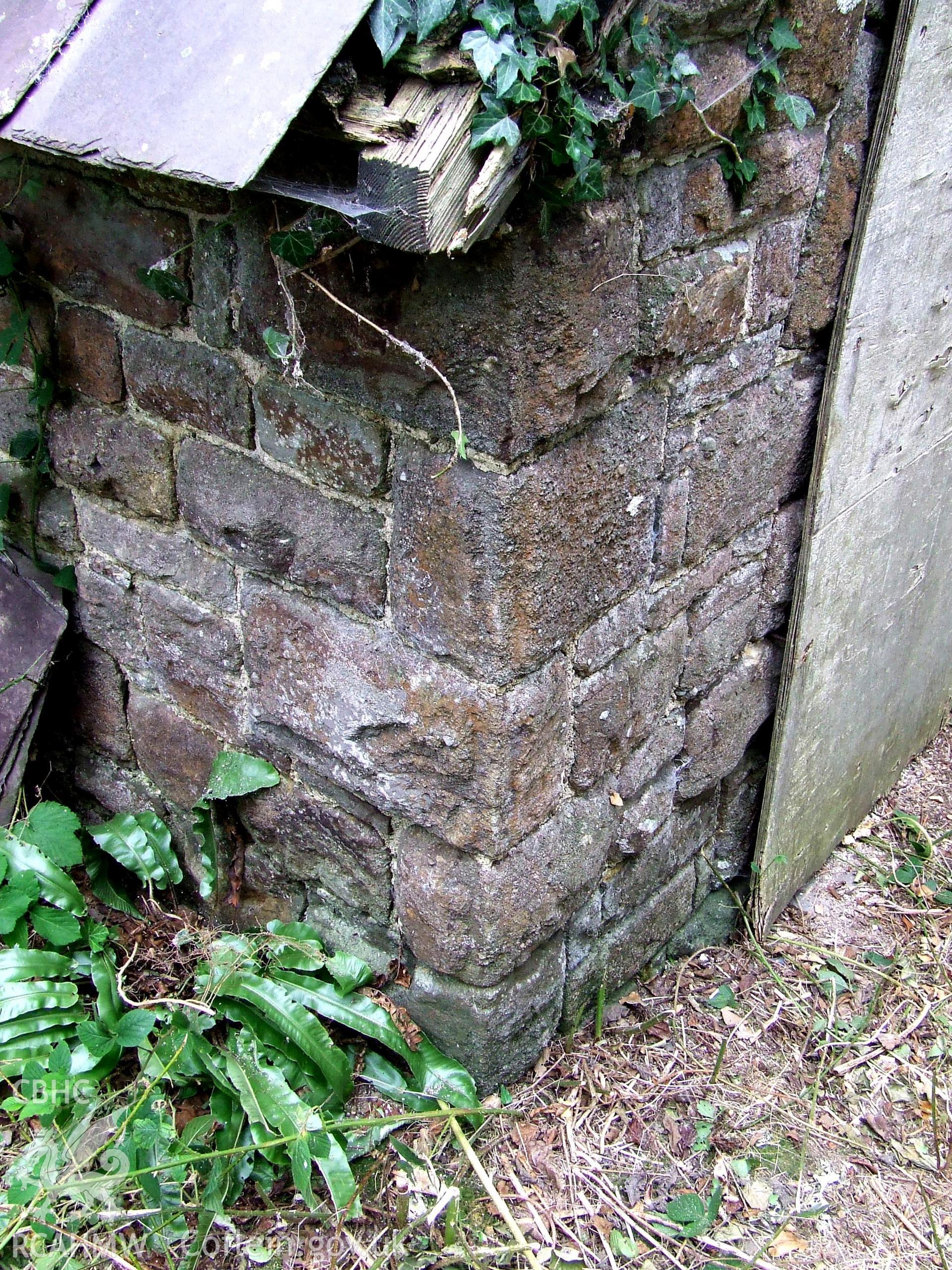 Digital colour photograph showing exterior - porch coins, at Castell Dwyran church.