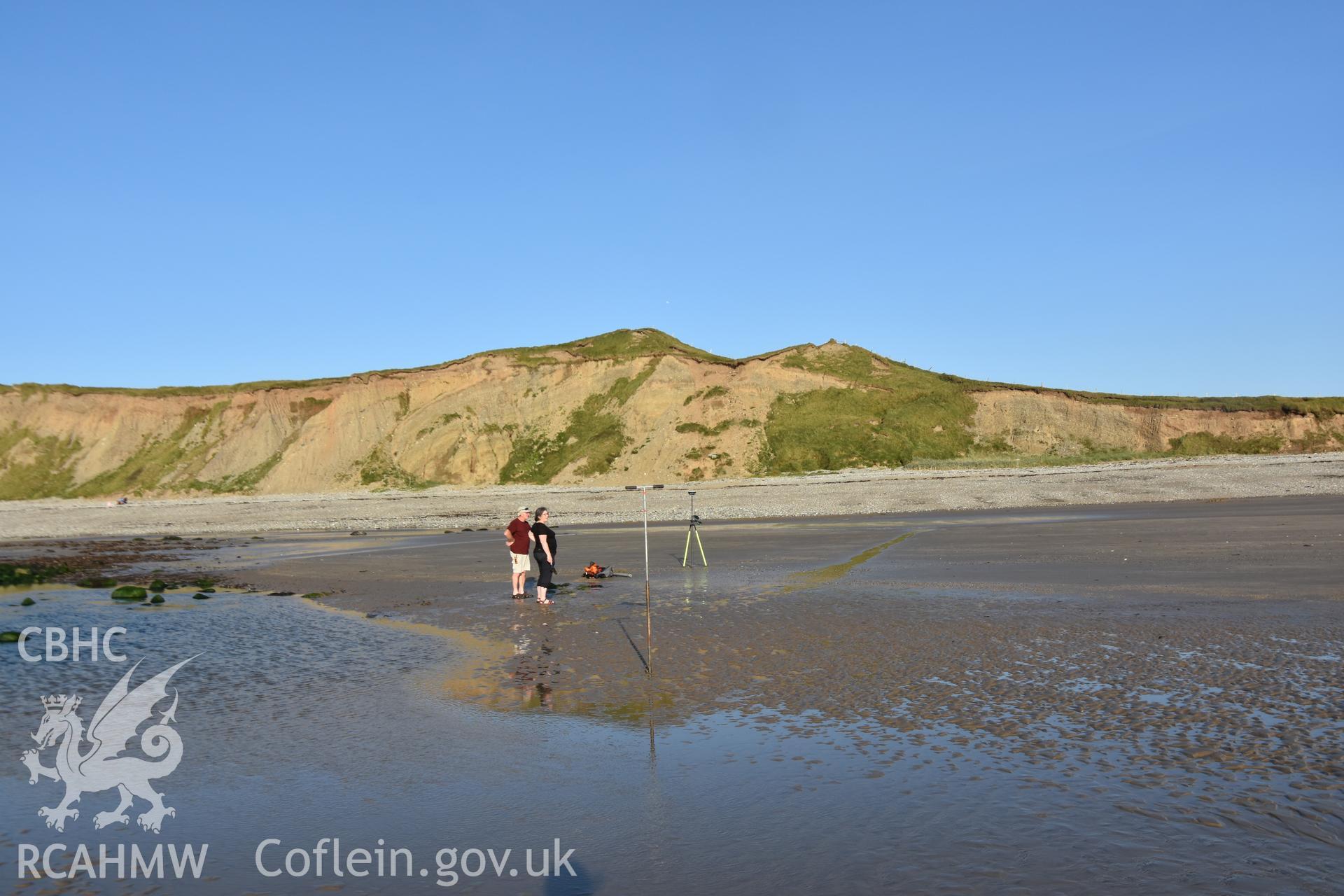 CHERISH team undertaking coring and survey on the beach at Dinas Dinlle. Photograph taken in September 2020 by Toby Driver as part of repeat monitoring and survey by the CHERISH project. © Crown: CHERISH PROJECT 2020. Produced with EU funds through the Ireland Wales Co-operation Programme 2014-2023. All material made freely available through the Open Government Licence.