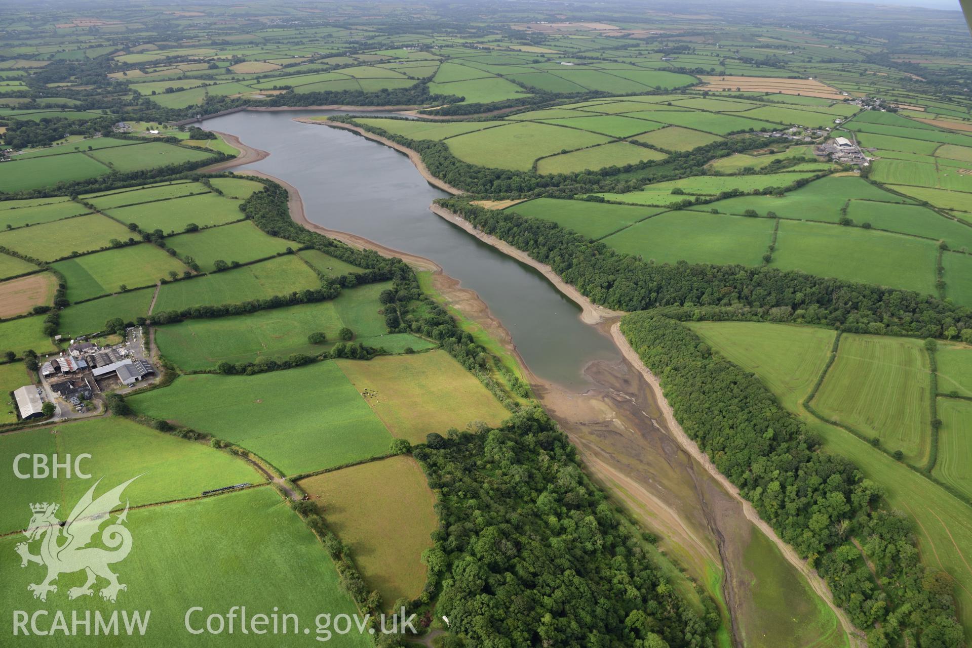 Long view of Llys y Fran Reservoir, Pembrokeshire, under drought conditions. Oblique aerial photograph taken during the Royal Commission’s programme of archaeological aerial reconnaissance by Toby Driver on 19 August 2022.