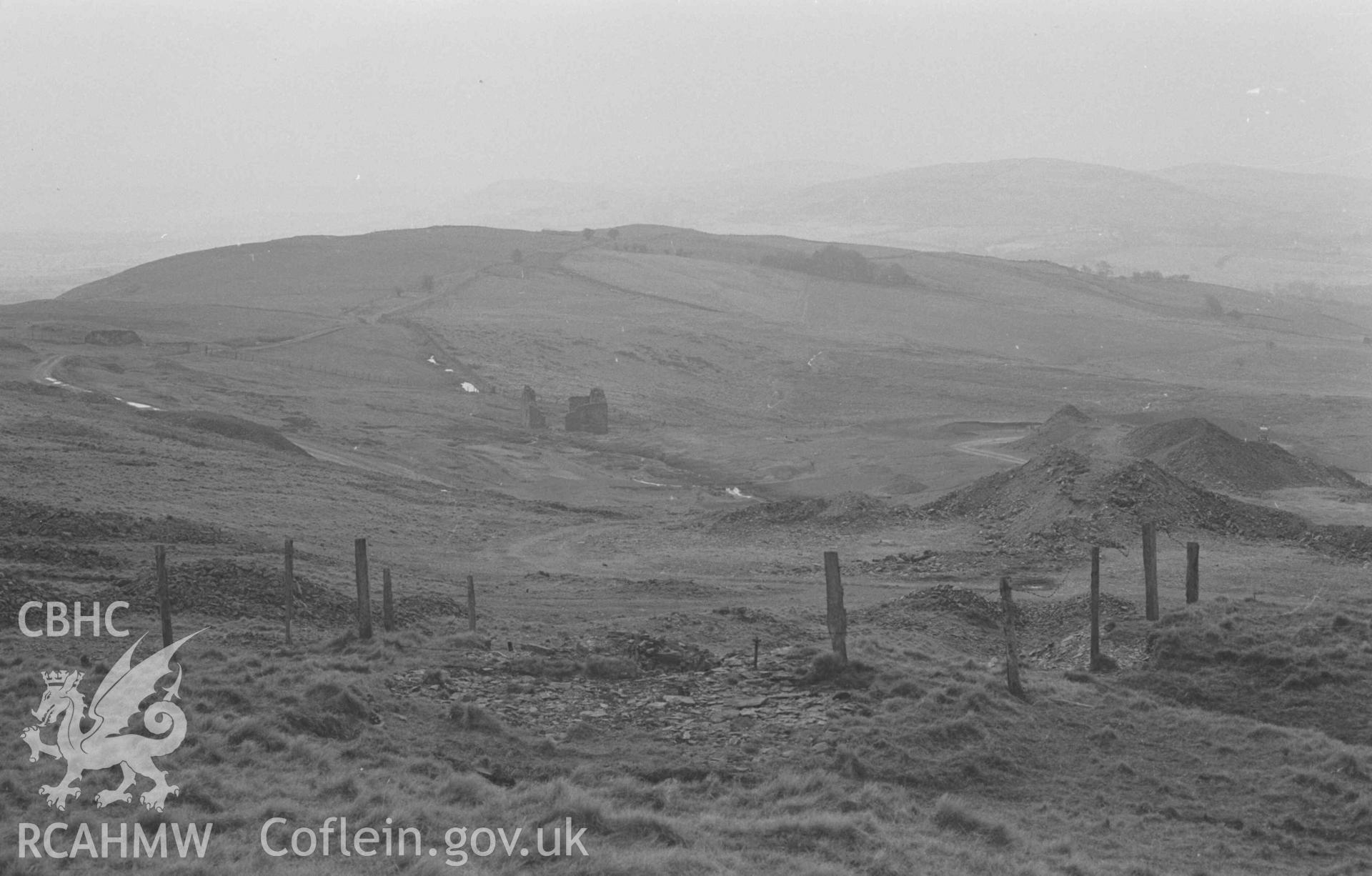 Digital copy of a black and white negative showing the workings at the west side of Glog-Fawr mine, where shallow workings were in existence before 1834. Photographed by Arthur Chater on 14 April 1968. Looking west from Grid Reference SN 748 711.