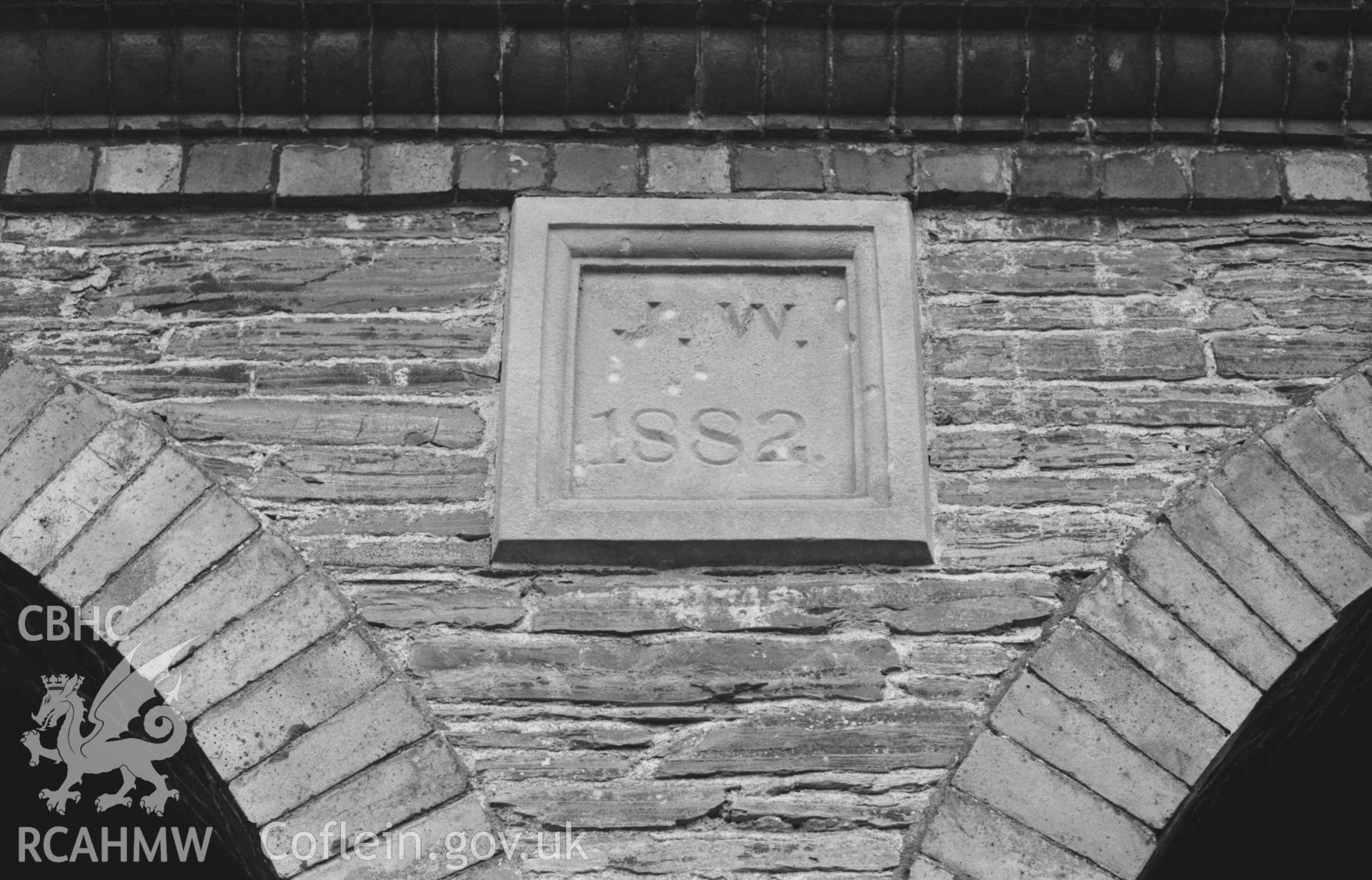 Digital copy of a black and white negative showing inscription on stables at the back of Hafod-Uchtryd. Photographed by Arthur Chater on 23 December 1968. Looking north east from Grid Reference SN 7595 7329.