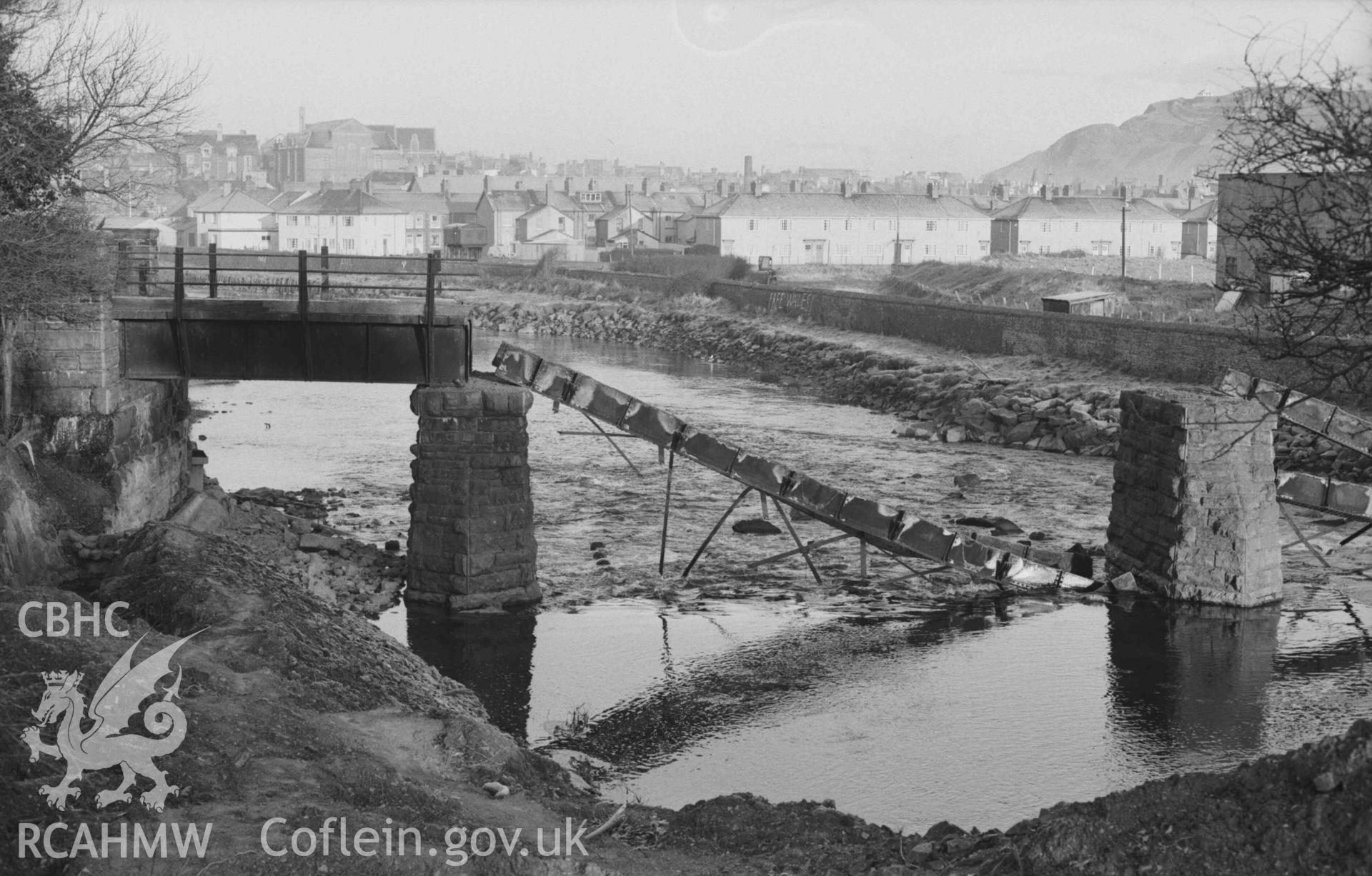 Digital copy of a black and white negative showing railway bridge over the Rheidol, from the river bank at the bottom of the garden of Bryn Rheidol. Photographed by Arthur Chater on 27 December 1968. Looking north north west from Grid Reference SN 5850 8108.