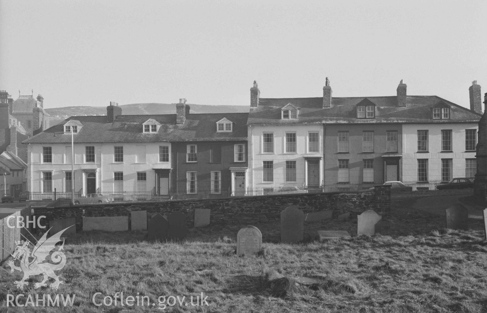 Digital copy of a black and white negative showing Laura Place from St Michael's churchyard. Photographed by Arthur Chater on 27 December 1968. Looking east north east from Grid Reference SN 5803 8163.