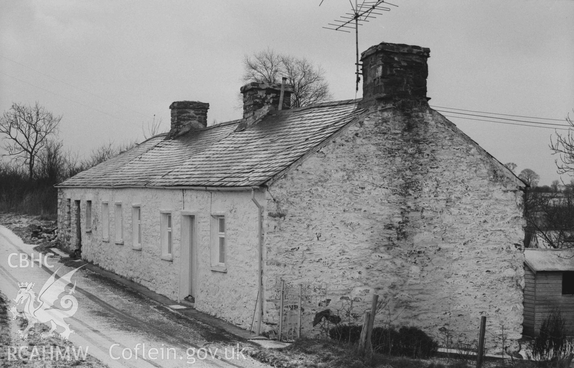 Digital copy of a black and white negative showing row of cottages immediately south of the mill. Photographed by Arthur Chater on 27 December 1968. Looking west south west from Grid Reference SN 6933 6613.