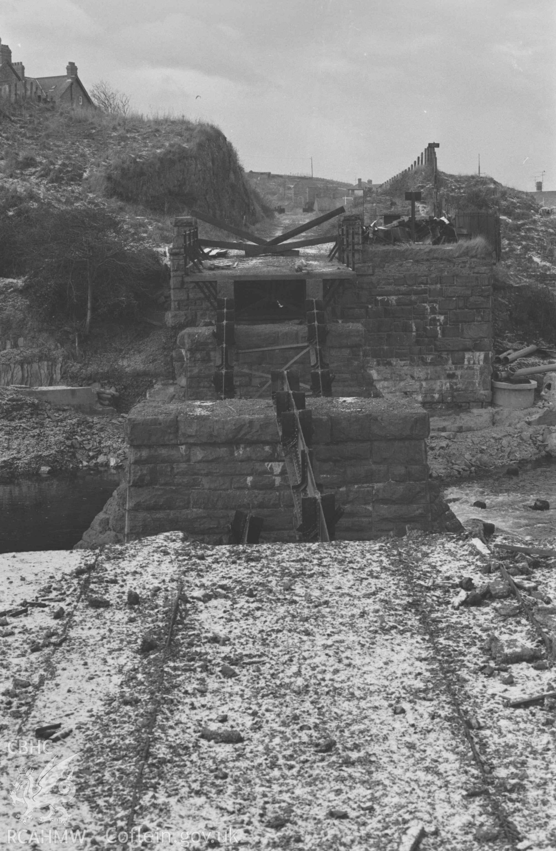 Digital copy of a black and white negative showing the ruined railway bridge over the Rheidol, Aberystwyth. Photographed by Arthur Chater on 28 December 1968. Looking west south west from Grid Reference SN 5853 8111.