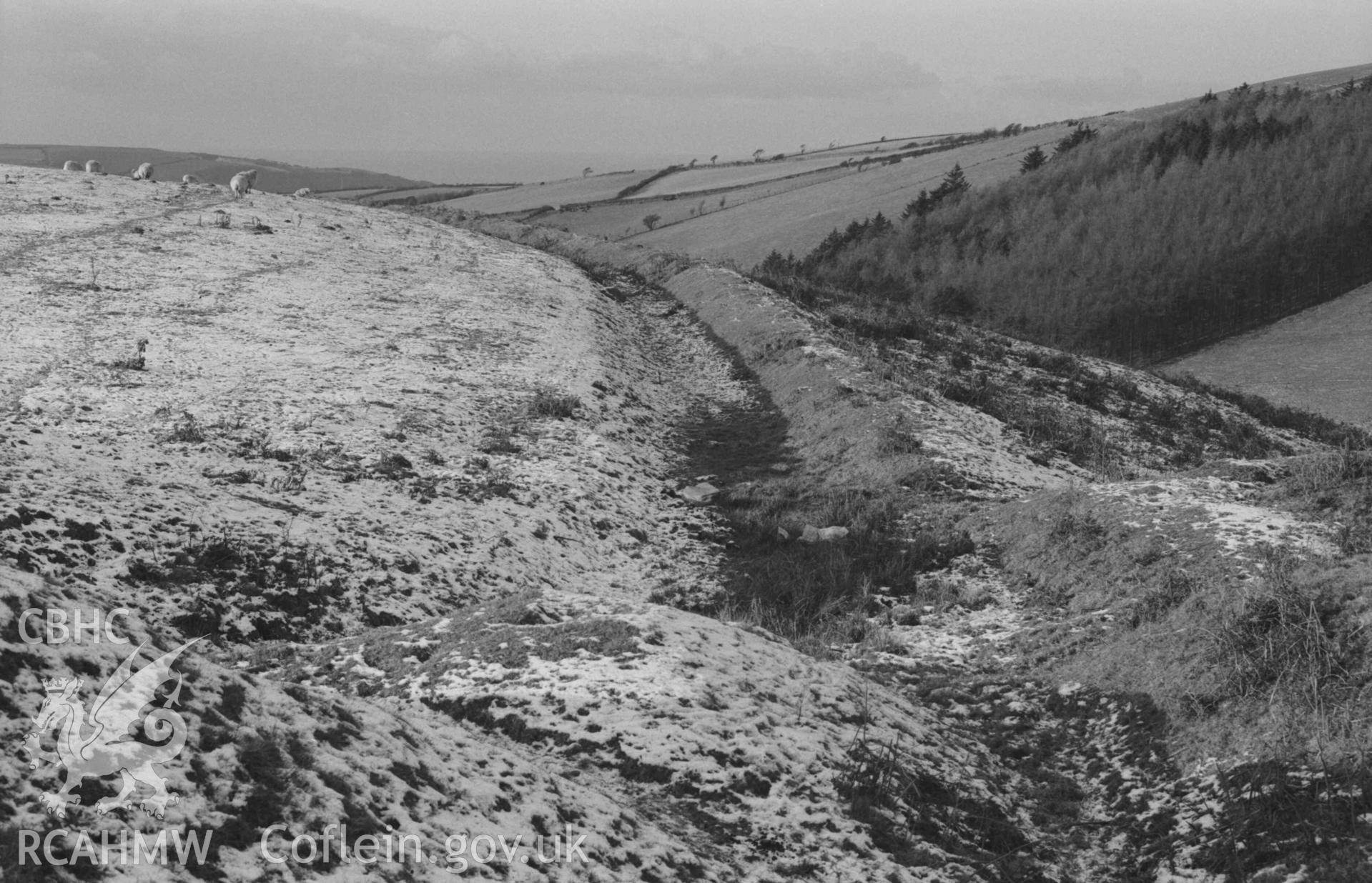 Digital copy of a black and white negative showing aqueduct at 625ft., seen from the track to Mynydd-Gorddu mine. Photographed by Arthur Chater on 29 December 1968. Looking west from Grid Reference SN 663 858.