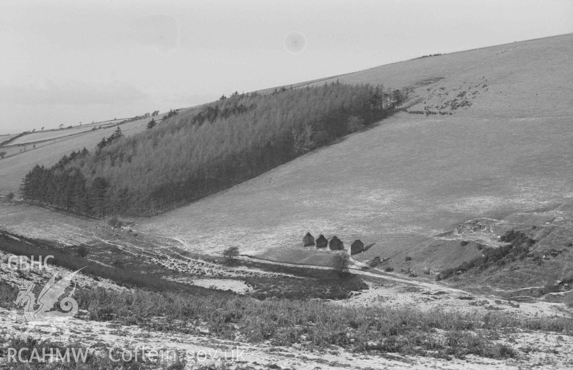 Digital copy of a black and white negative showing ruins of lead mine 500m down the valley from Mynydd-Gorddu mine. Photographed by Arthur Chater on 29 December 1968. Looking north west from Grid Reference SN 663 858.