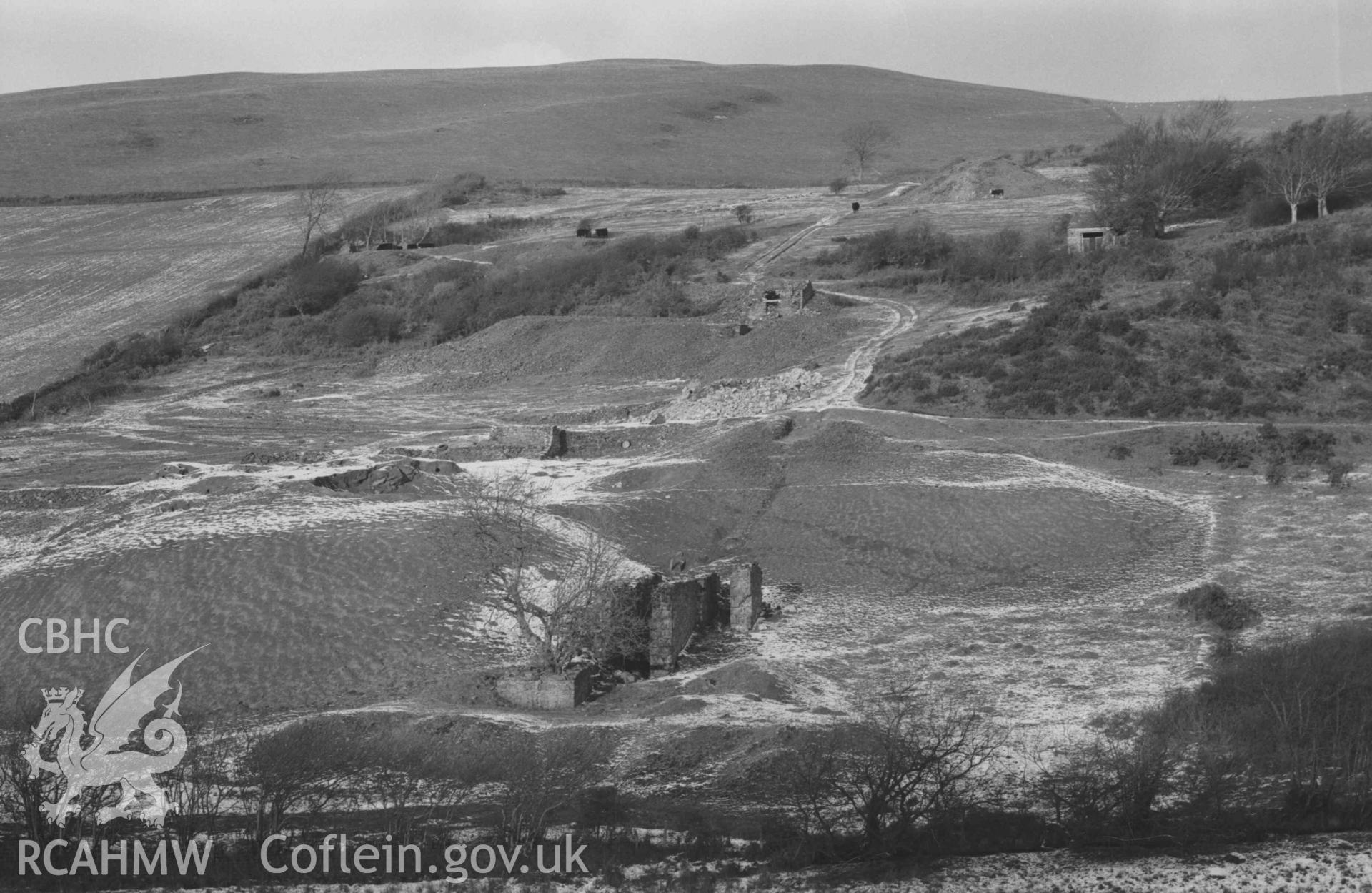 Digital copy of a black and white negative showing Mynydd-Gorddu mine. Photographed by Arthur Chater on 29 December 1968. Looking north from Grid Reference SN 6675 8582.